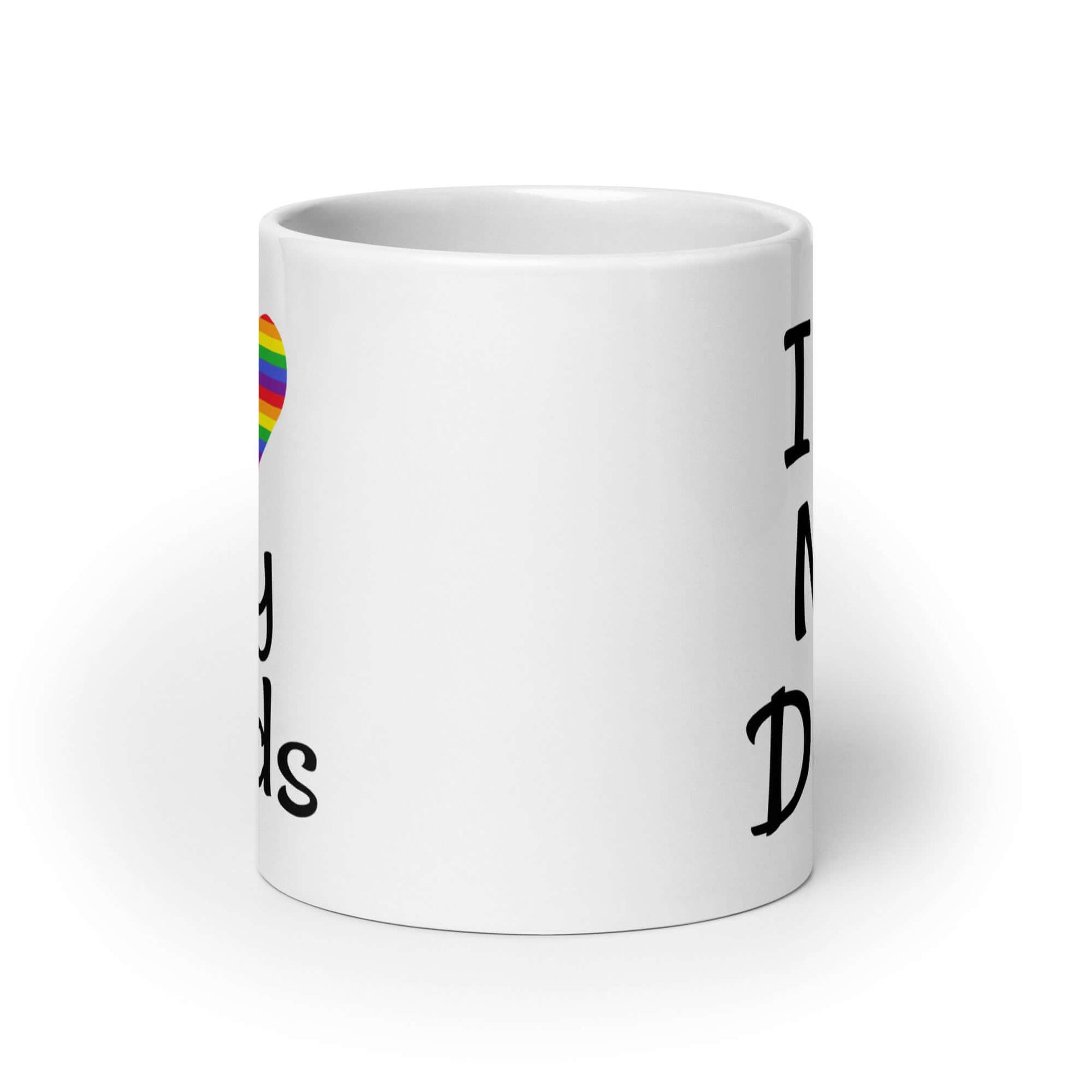 White ceramic coffee mug with the phrase I heart my dads printed on both sides of the mug. The heart is rainbow.