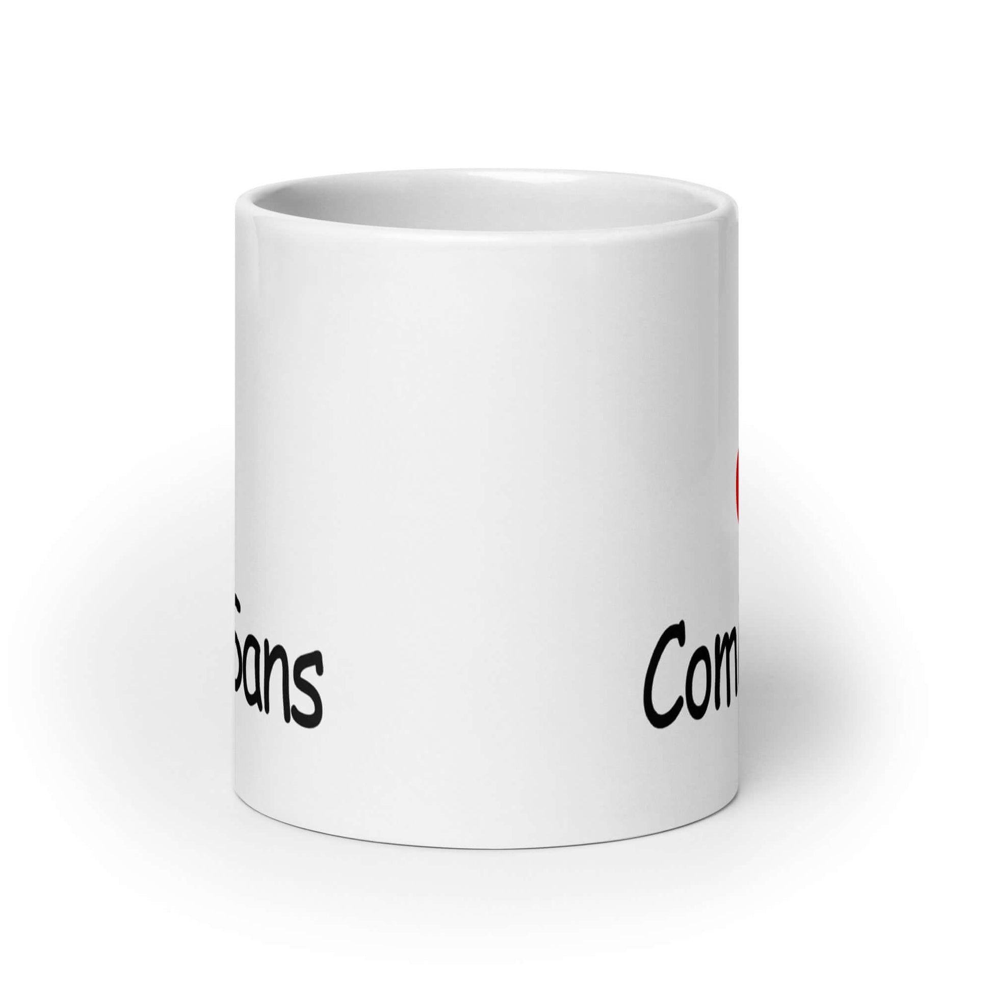 White ceramic coffee mug that says I heart Comic Sans on both sides of the mug. The text is in comic sans font.