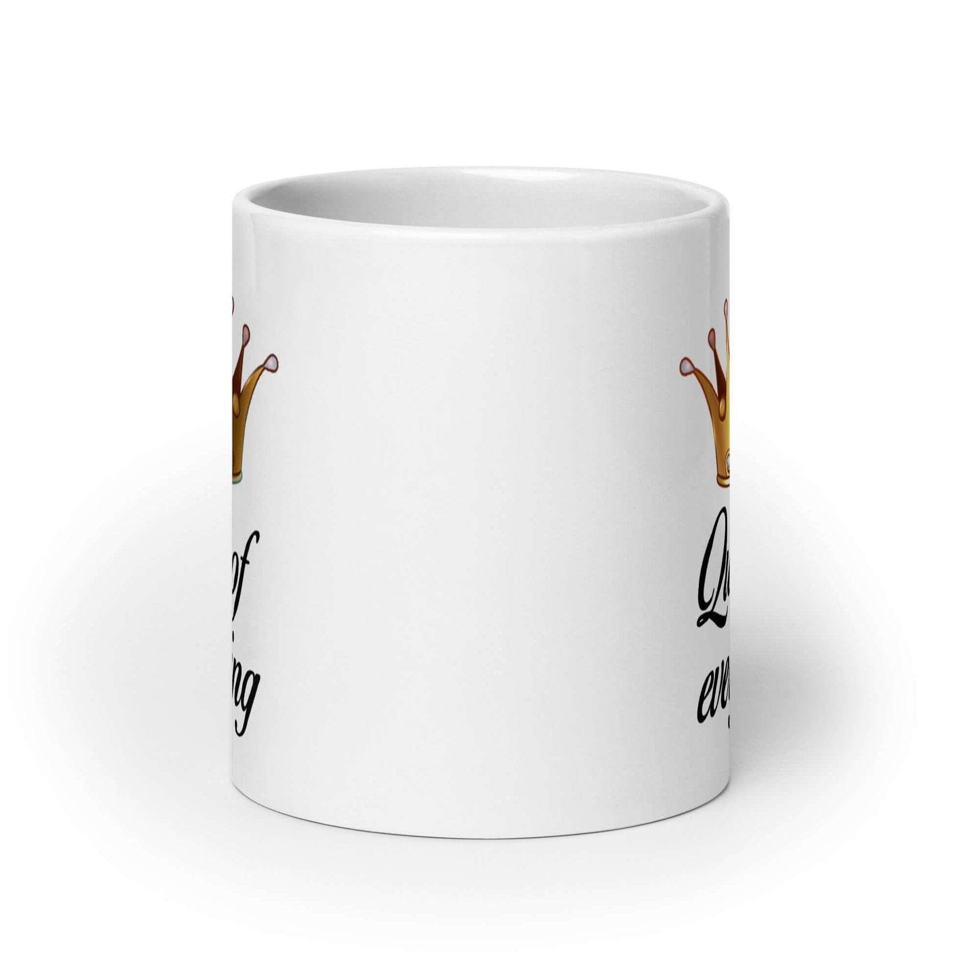 White ceramic coffee mug with an image of a crown and the phrase Queen of everything printed on both sides of the mug.