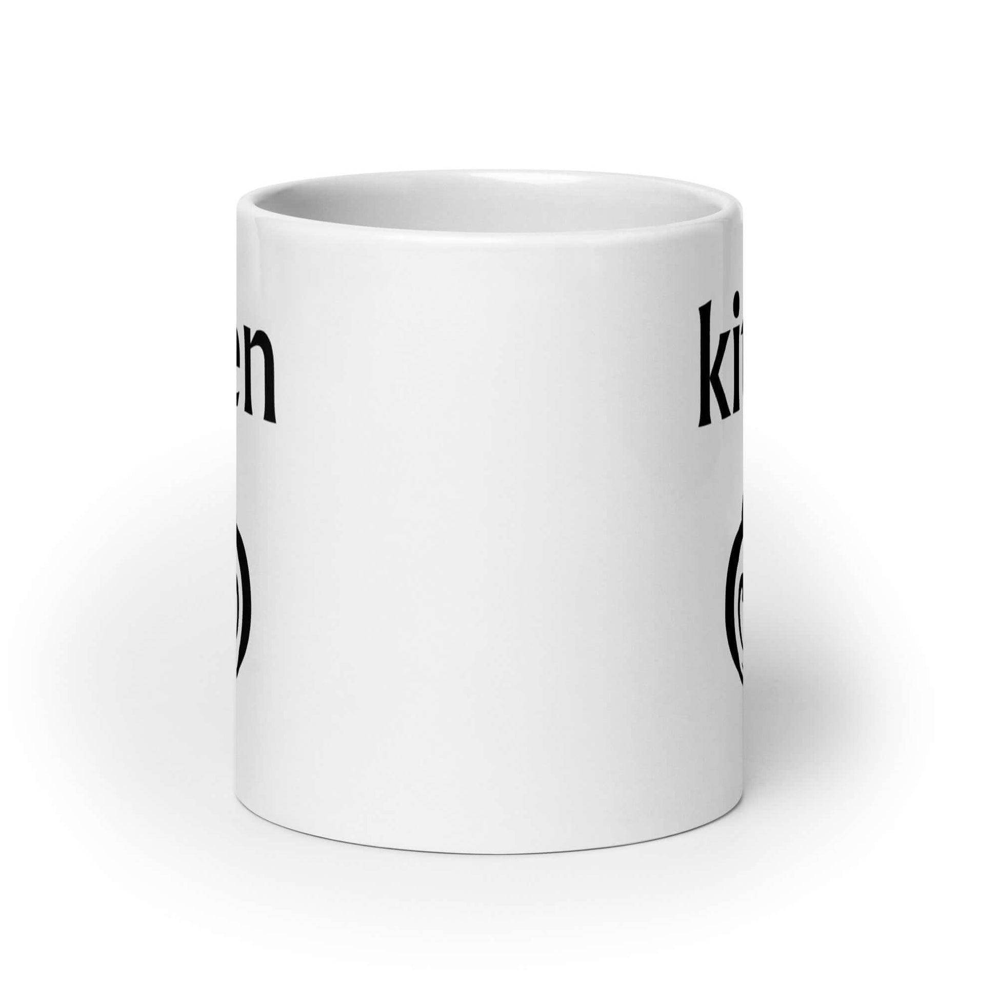 White ceramic coffee mug with an image of a BDSM heart shaped lock and the word kitten printed on both sides of the mug.