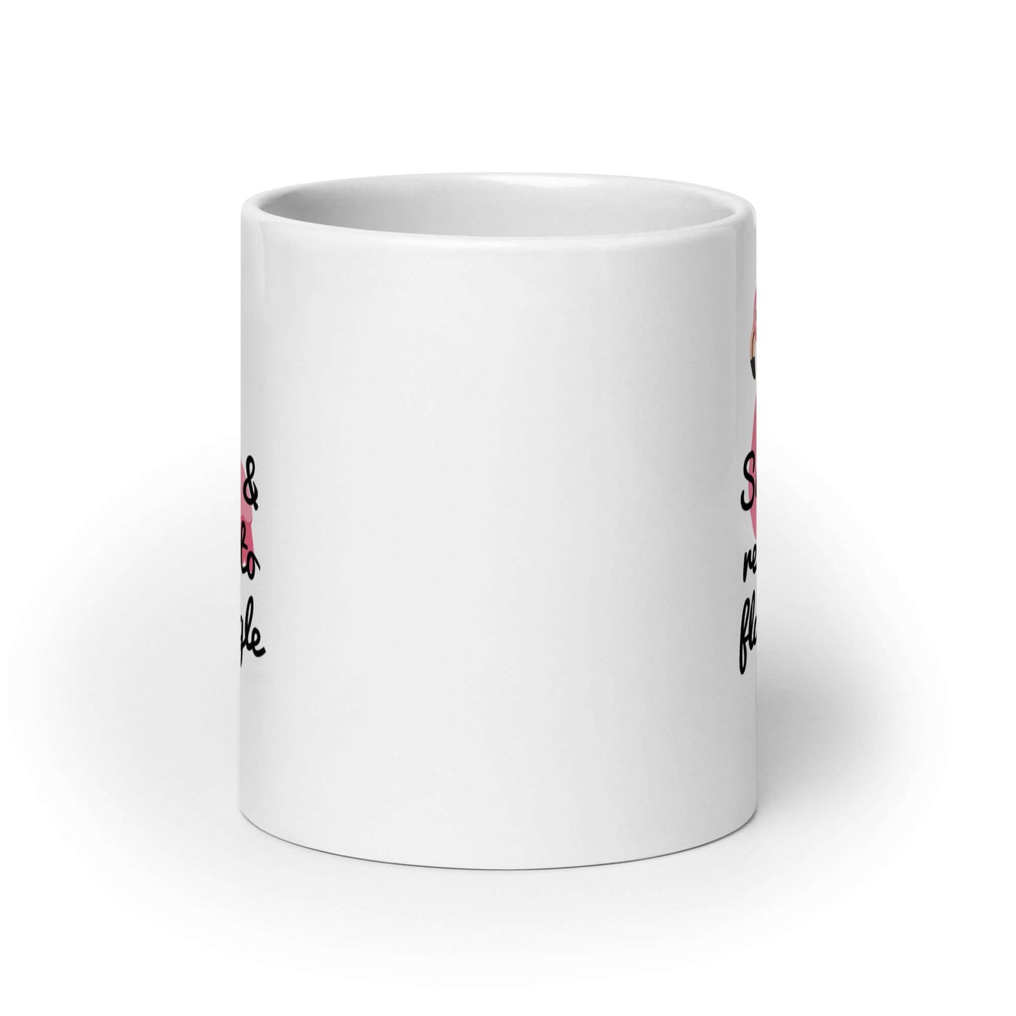 White ceramic coffee mug with image of a flamingo and the words Single and ready to flamingle printed on both sides.