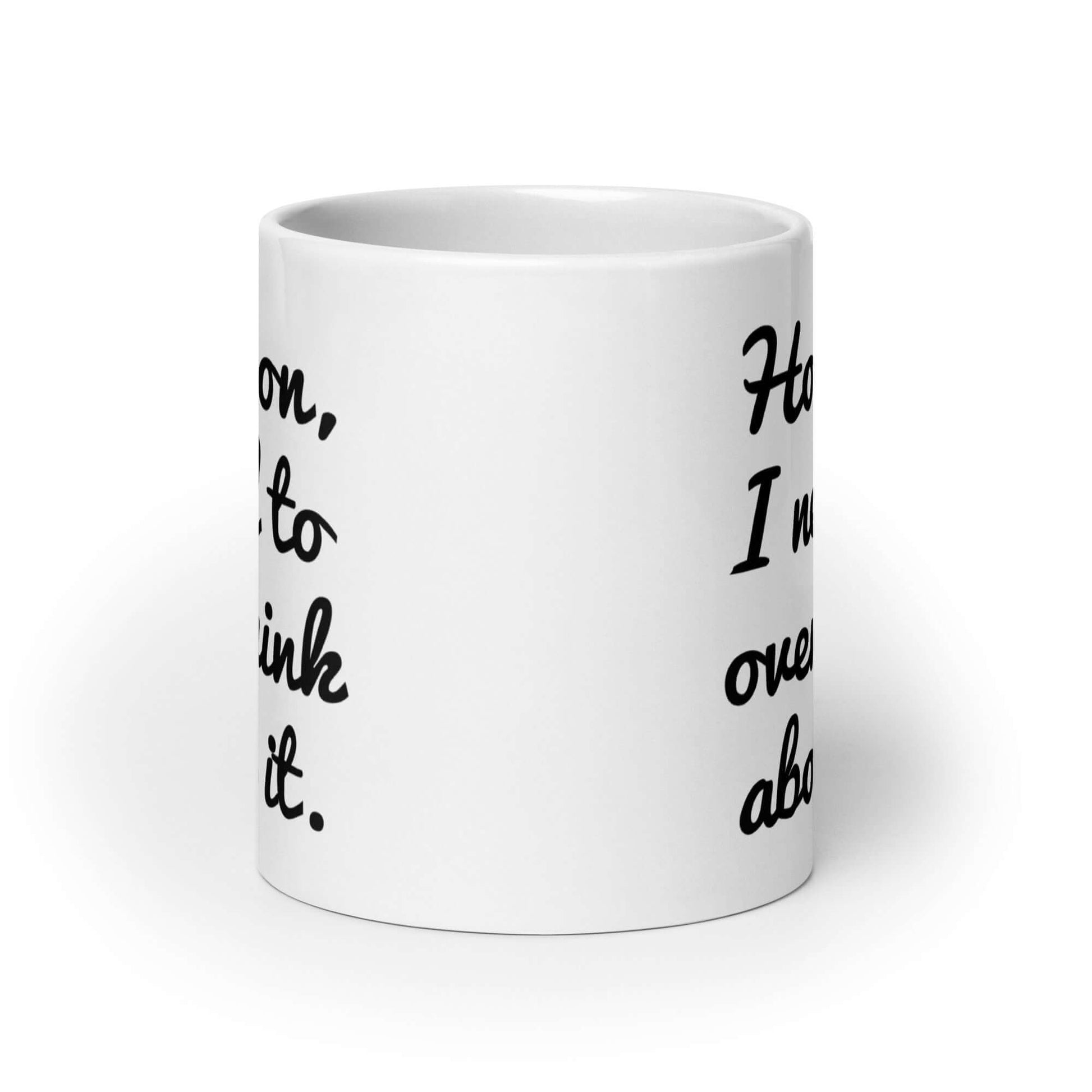 White ceramic coffee mug with the funny phrase Hold on, let me overthink about it printed on both sides of the mug.