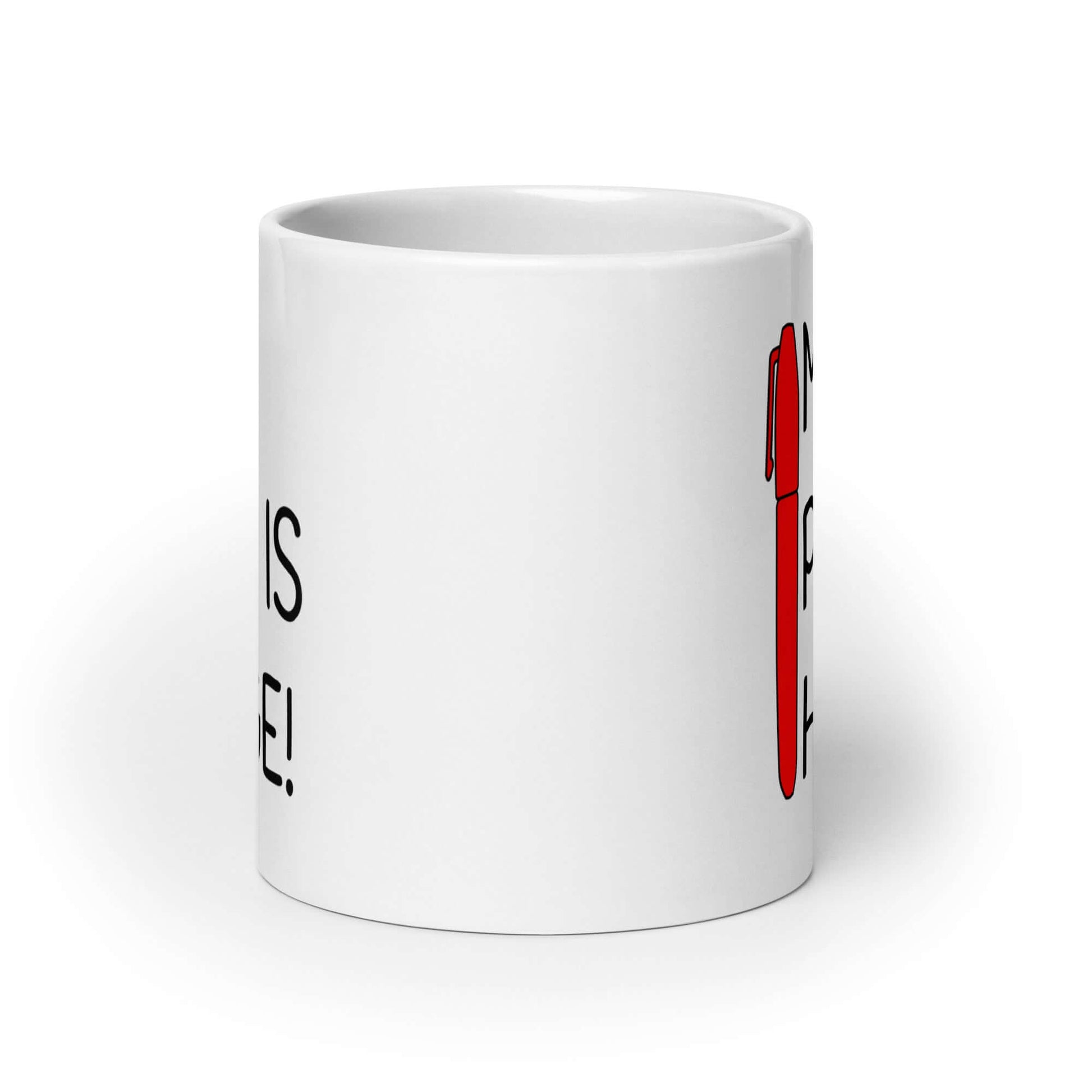 White ceramic mug with an image of a big red pen and the words My pen is huge printed on both sides. The words Pen and is are close together so that at first glance it appears that it says penis instead of pen is.