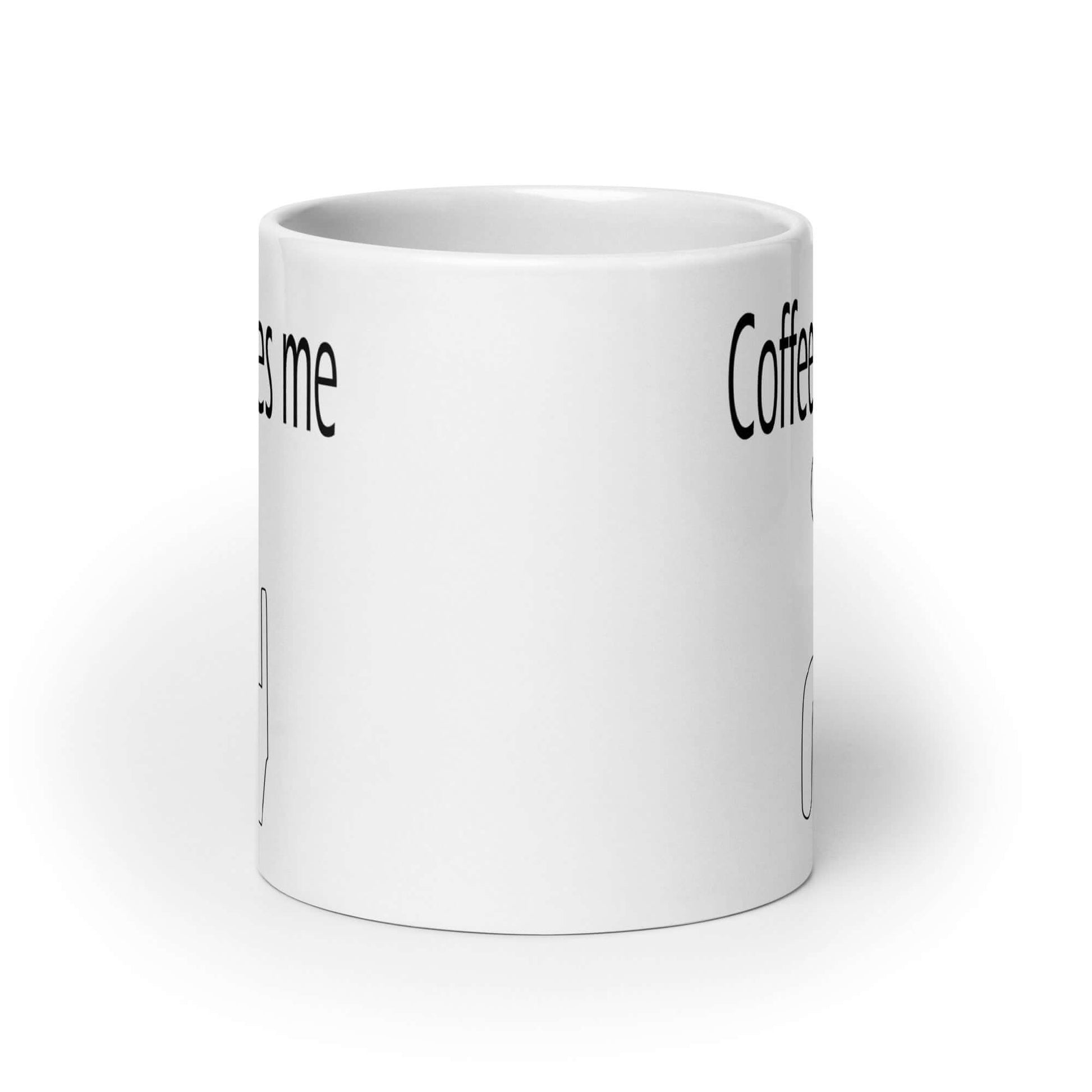 White ceramic coffee mug with the words Coffee makes me and a line drawing of a toilet. The graphics are printed on both sides of the mug.