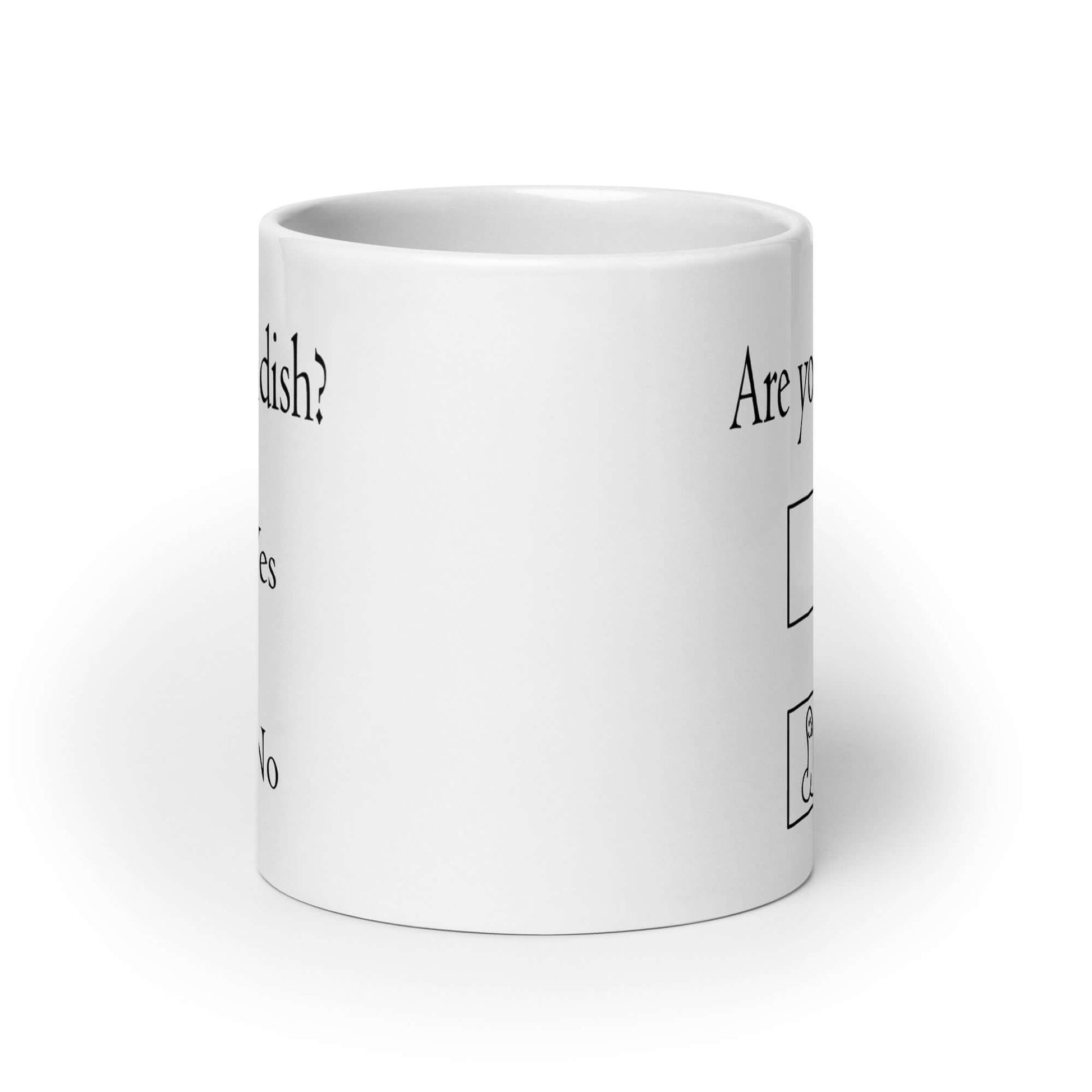 White ceramic coffee mug with the words Are you childish question mark. There are 2 check boxes to select Yes or No. There is a penis drawn inside of the No box. The graphics are printed on both sides of the mug.