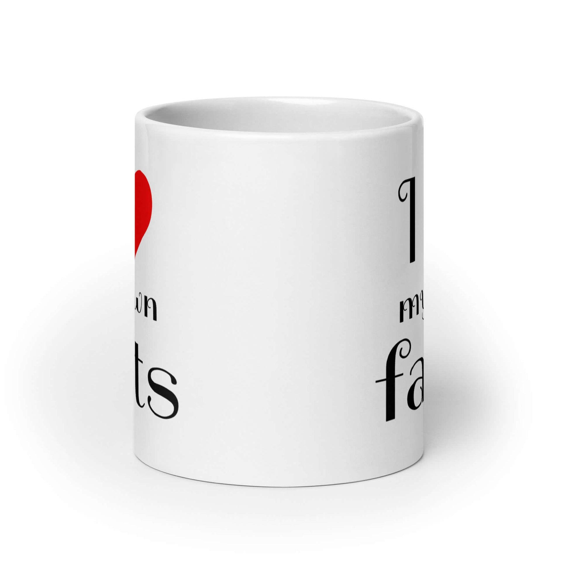 White ceramic coffee mug with I heart my own farts printed on both sides of the mug.