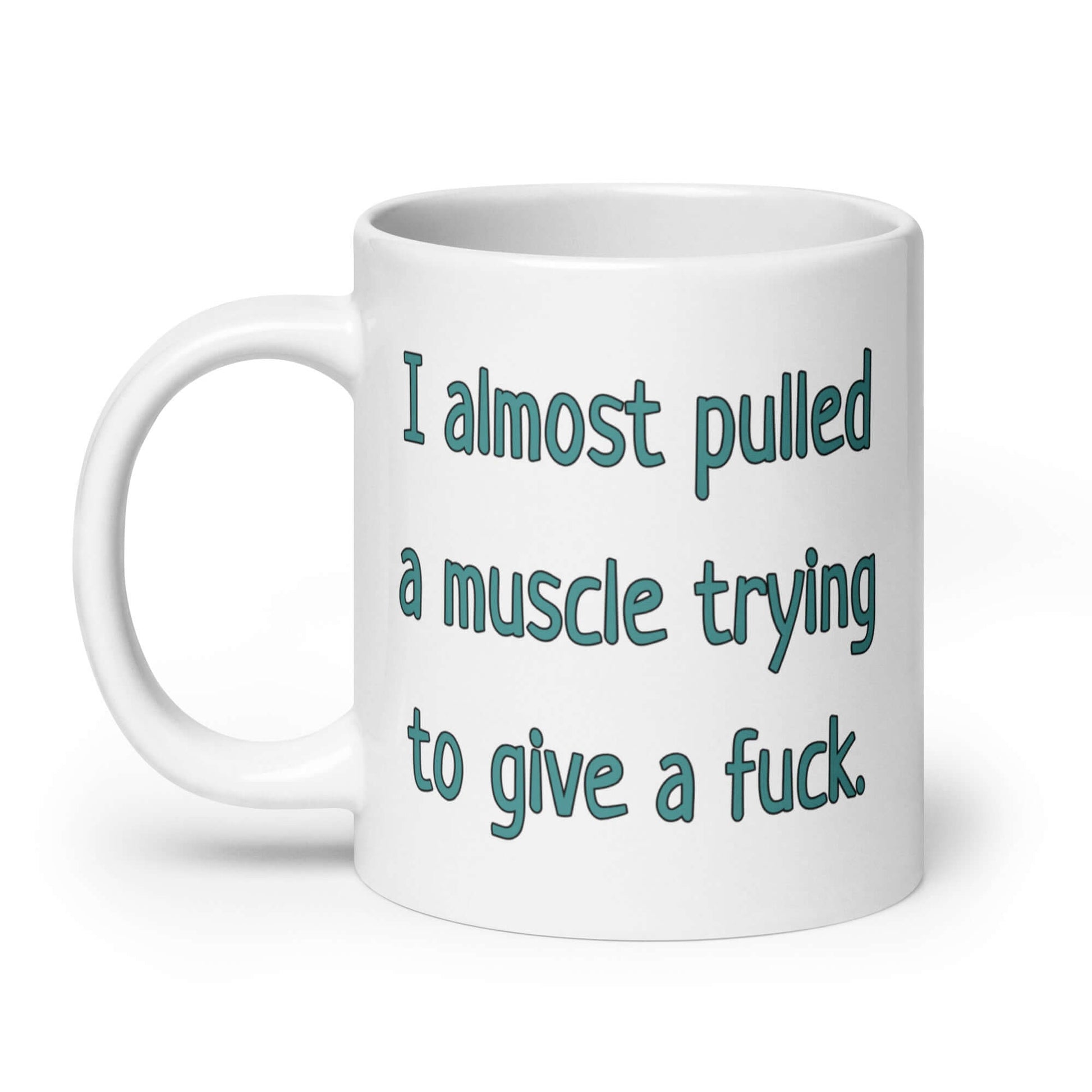White ceramic coffee mug with the words I almost pulled a muscle trying to give a fuck printed on both sides.