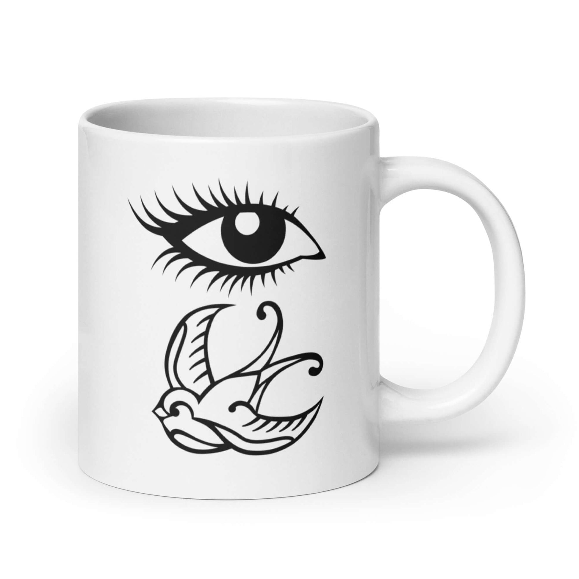 White ceramic mug with outline drawing of an eye and a swallow bird printed on both sides.