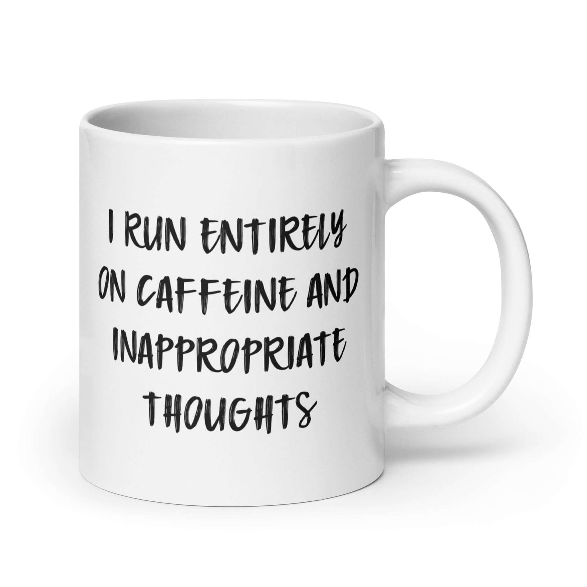 White ceramic coffee mug with the words I run entirely on caffeine & inappropriate thoughts printed on both sides.