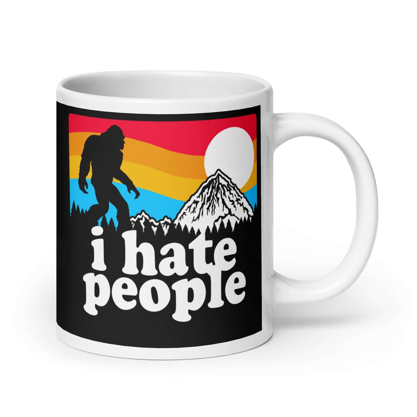 White coffee mug with graphic of Bigfoot walking into the sunset with the words I hate people printed on both sides. 