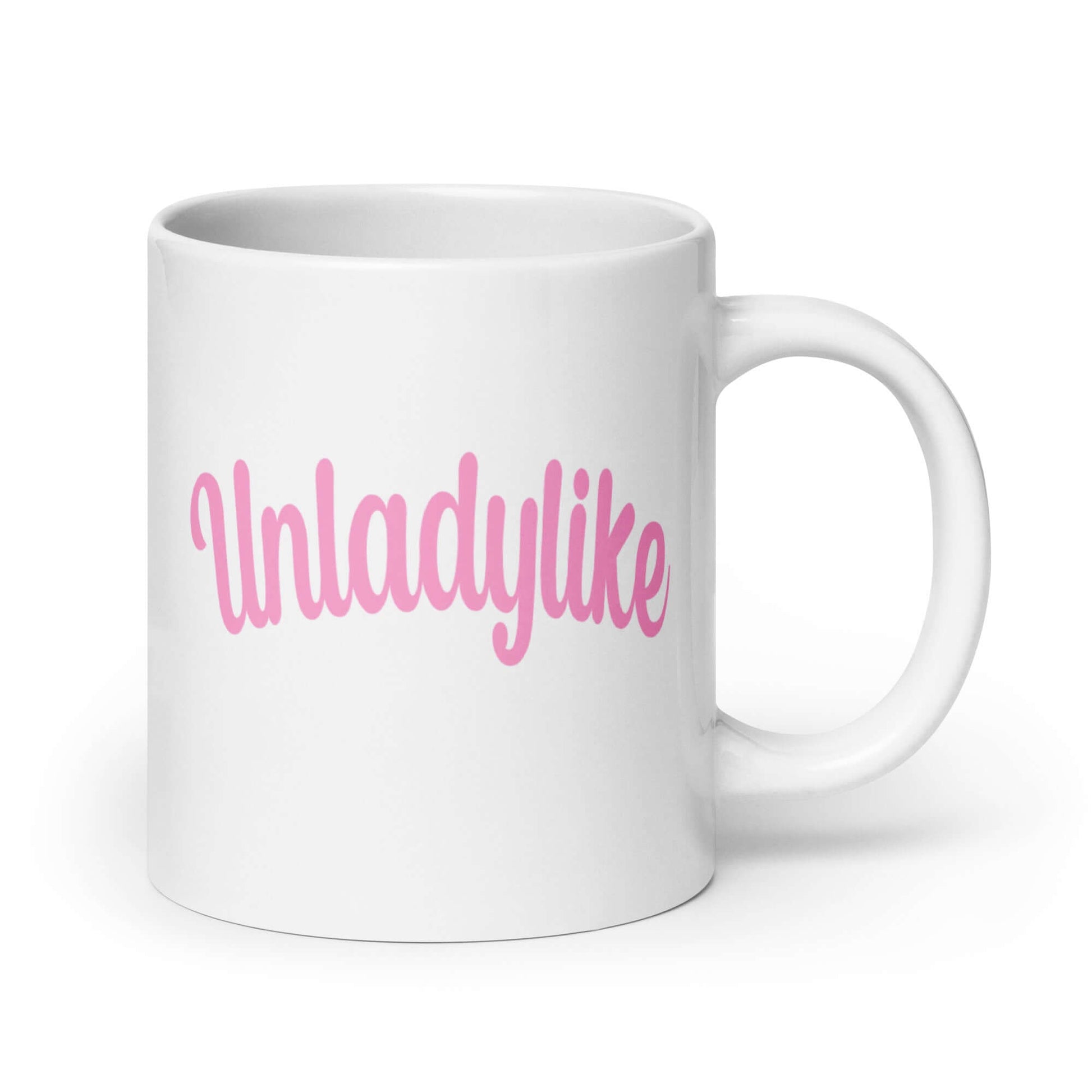 White ceramic coffee mug with the word Unladylike printed in pink on both sides.