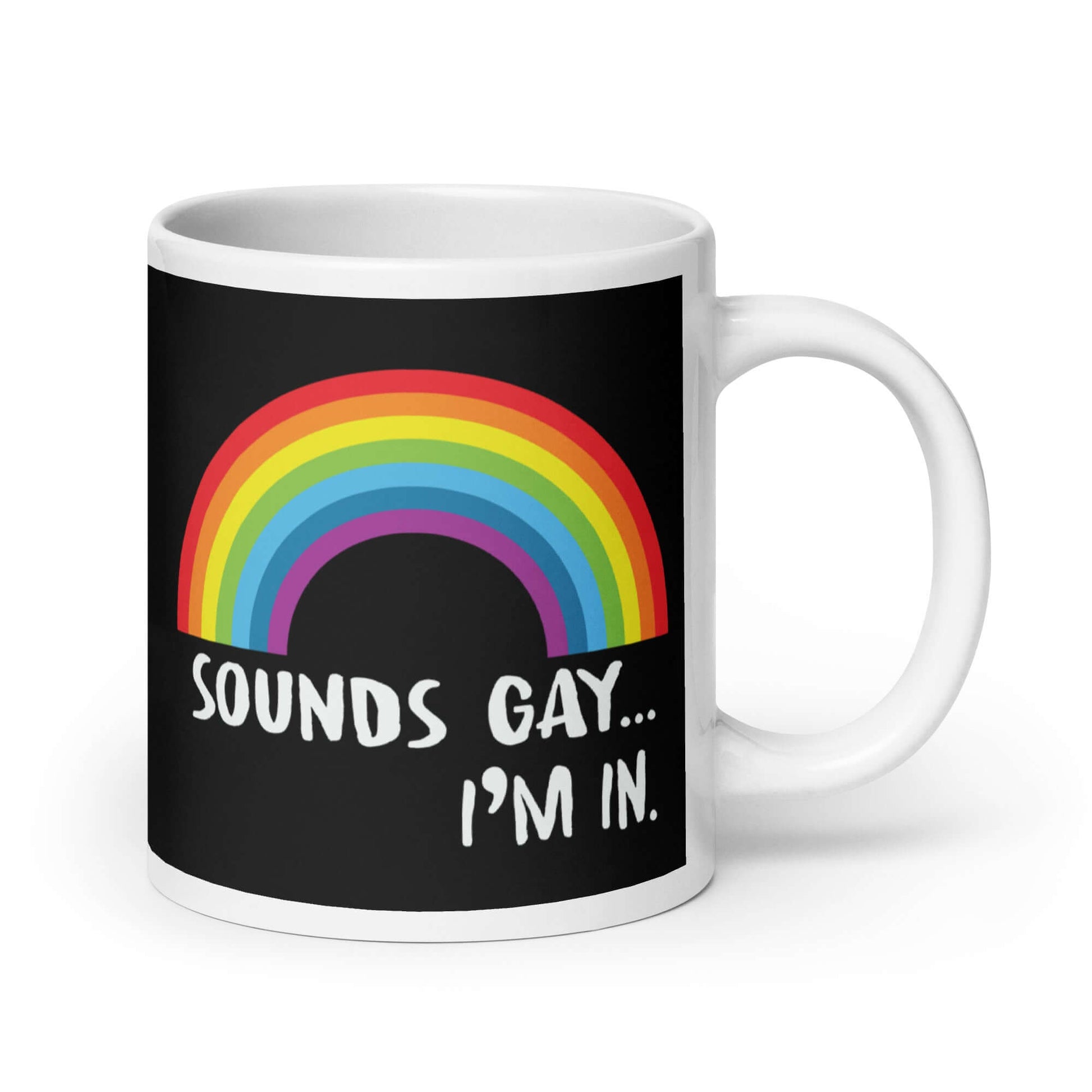 Black and white ceramic coffee mug that has an image of a rainbow and the phrase Sounds gay, I'm in printed on both sides.