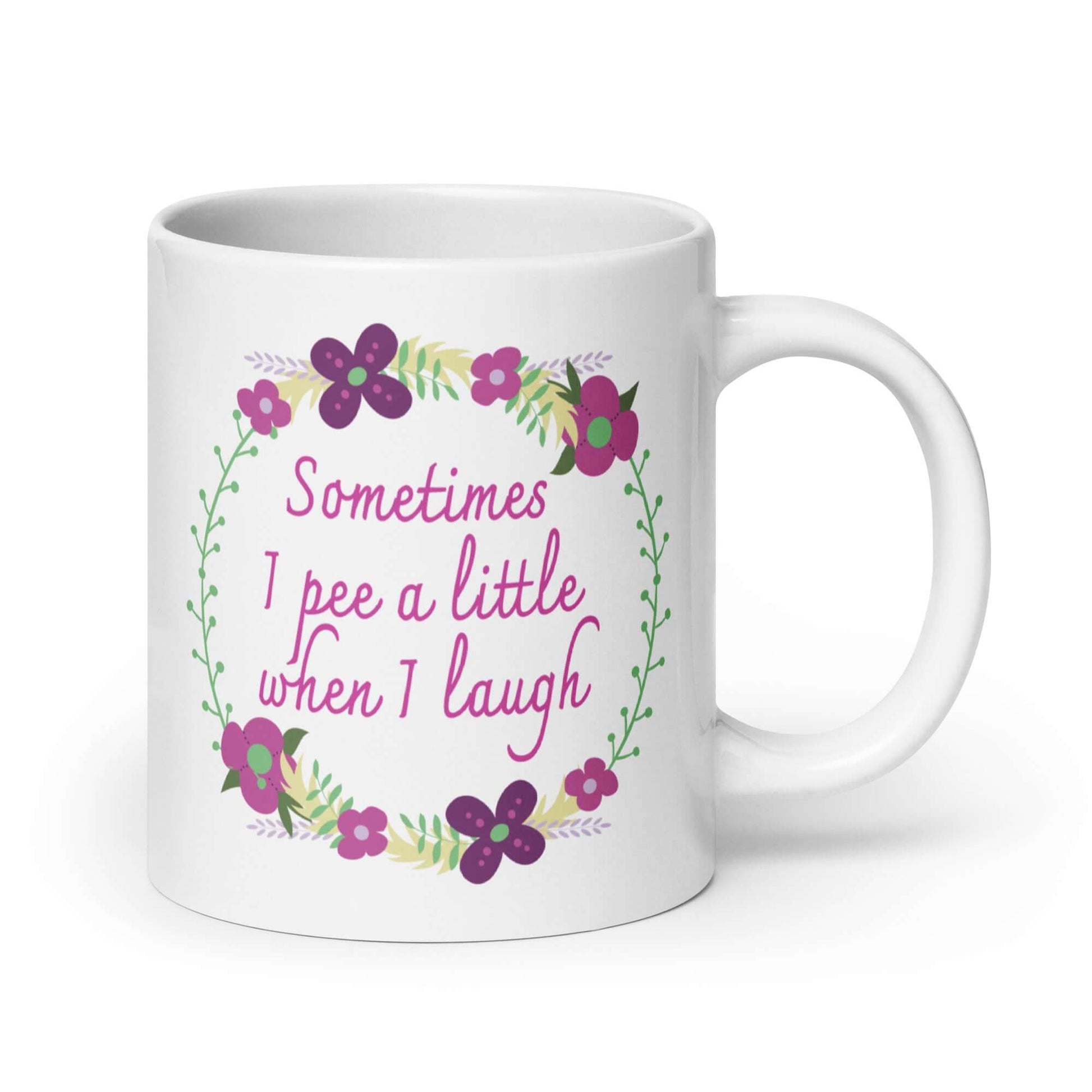 White ceramic coffee mug that has a minimalistic style line drawing floral wreath with the phrase Sometimes I pee a little when I laugh printed in the center of the wreath. The graphics are printed on both sides of the mug.