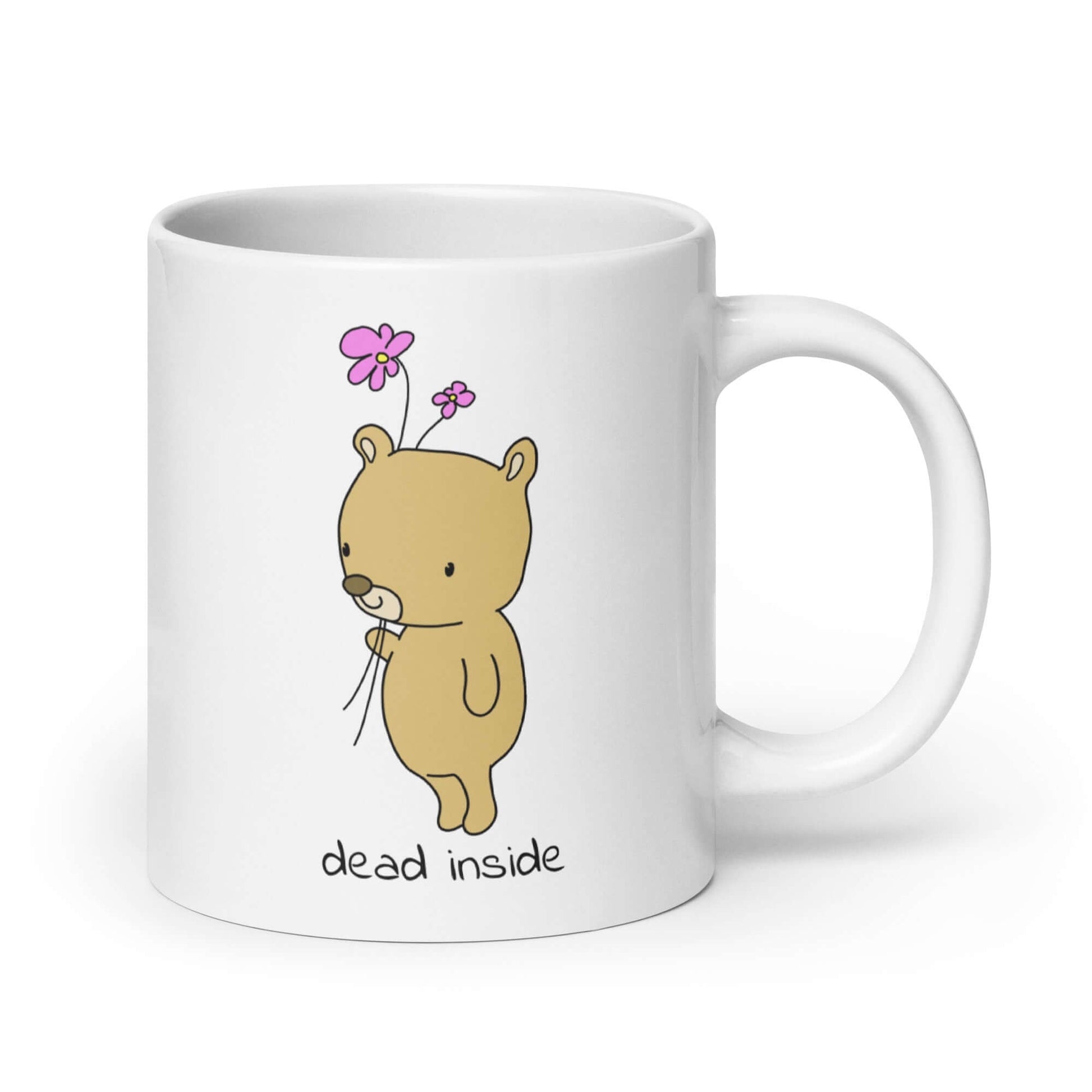 White ceramic coffee mug an image of a cute bear holding 2 pink flowers. The words Dead inside are printed underneath the bear. The graphics are printed on both sides of the mug.