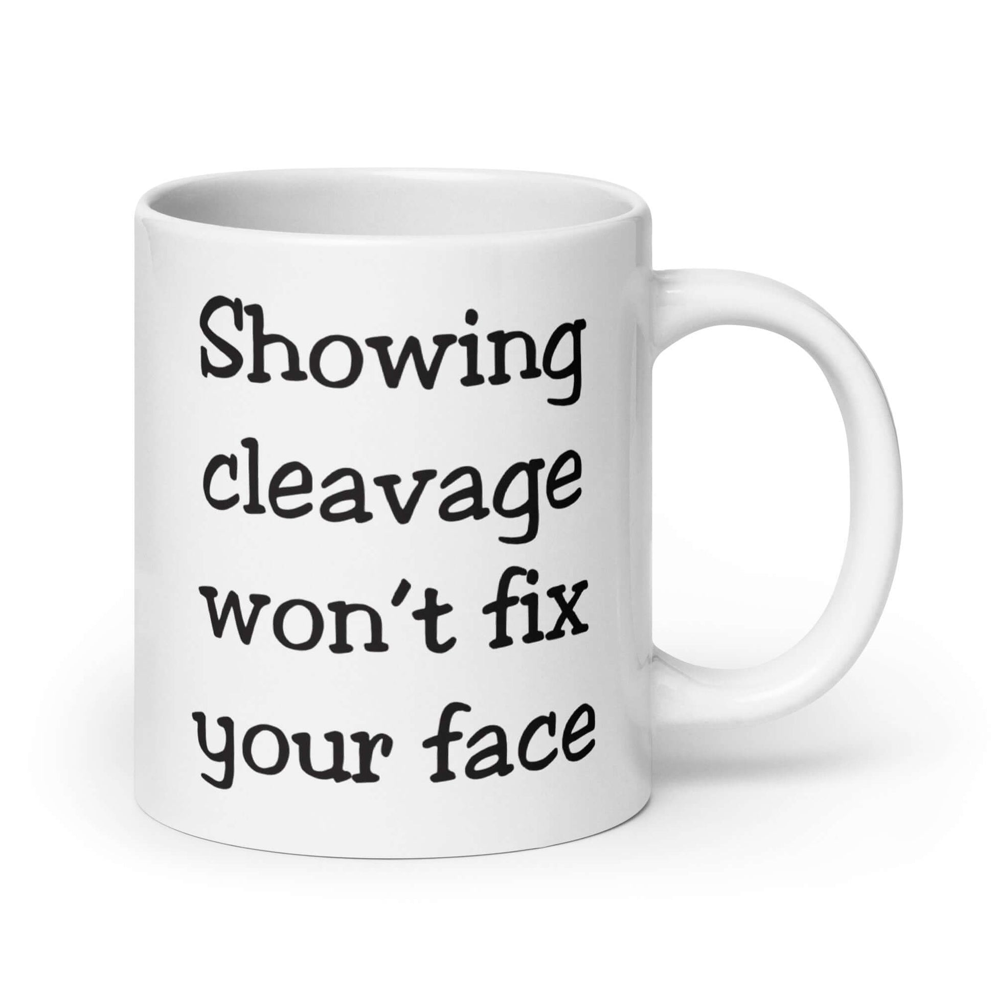 White ceramic mug with the phrase Showing cleavage won't fix your face printed on both sides.