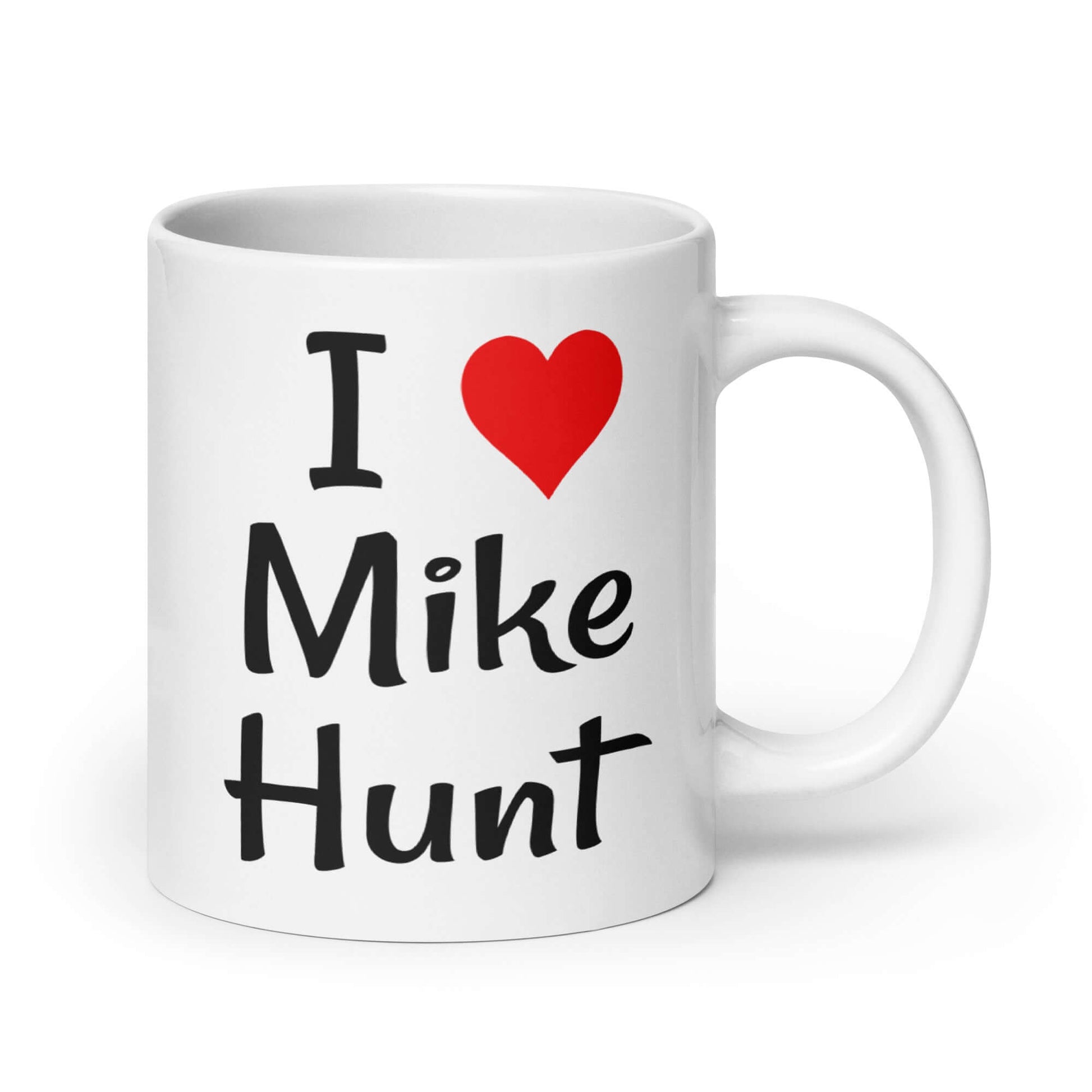 White ceramic coffee mug with pun I heart Mike Hunt printed on both sides of the mug. The heart is red.