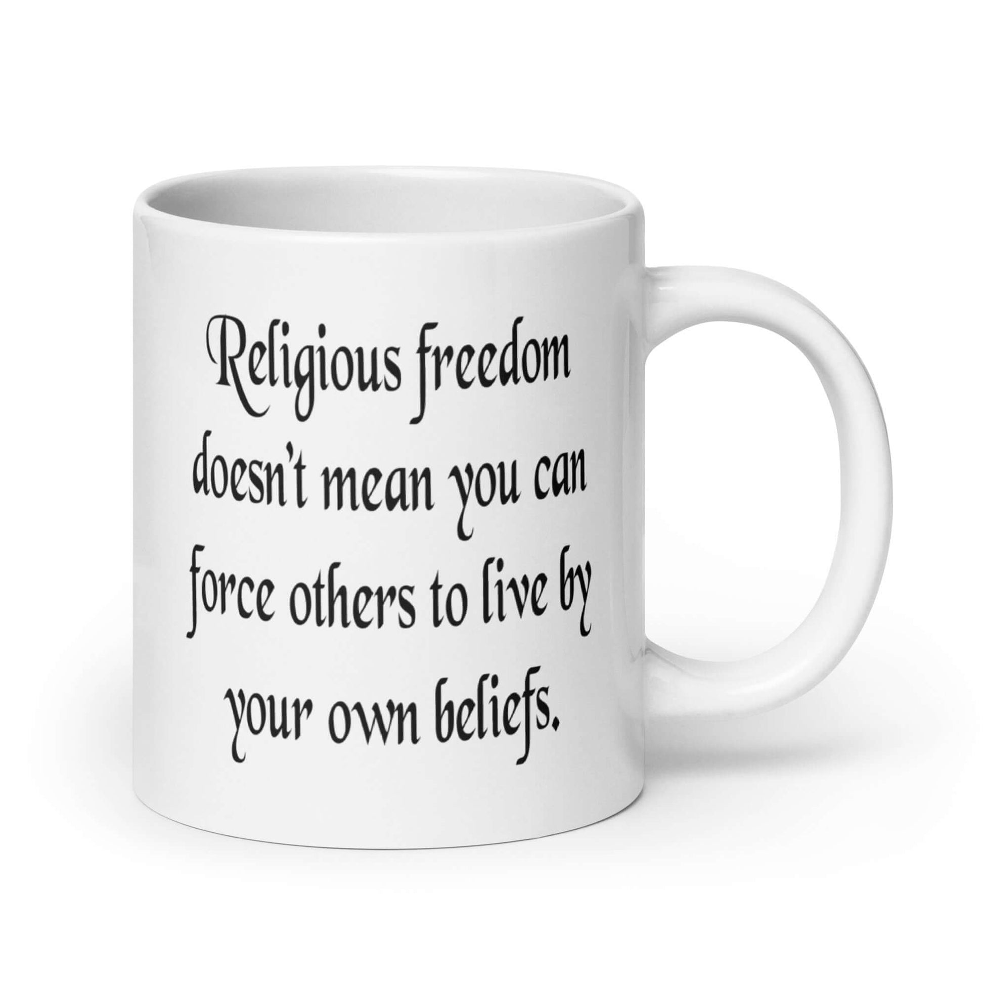 White ceramic coffee mug with the phrase Religious freedom doesn't mean you can force others to live by your own beliefs printed on both sides of the mug.