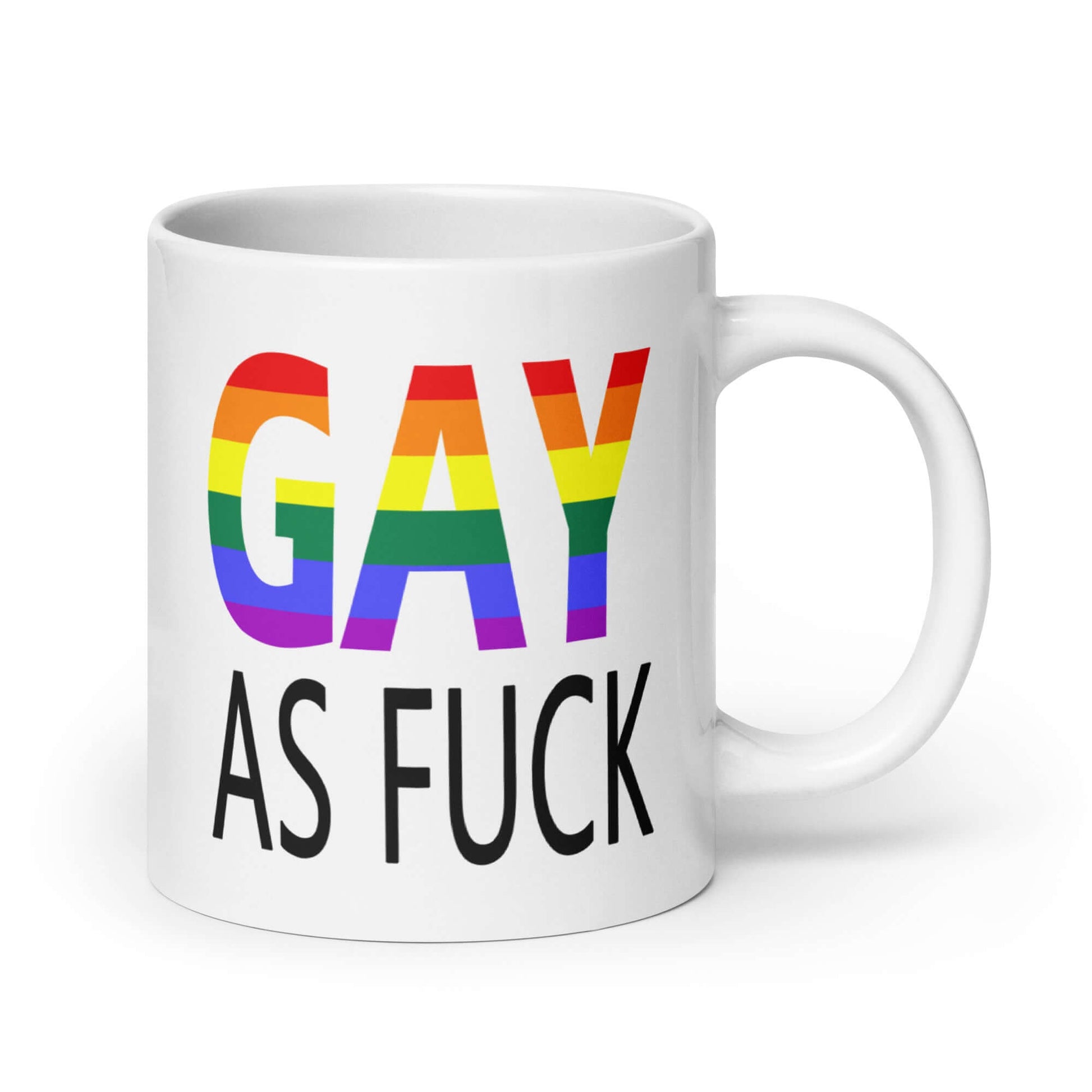 White ceramic mug with the words Gay as fuck printed on both sides. The word Gay is in rainbow stripe font.