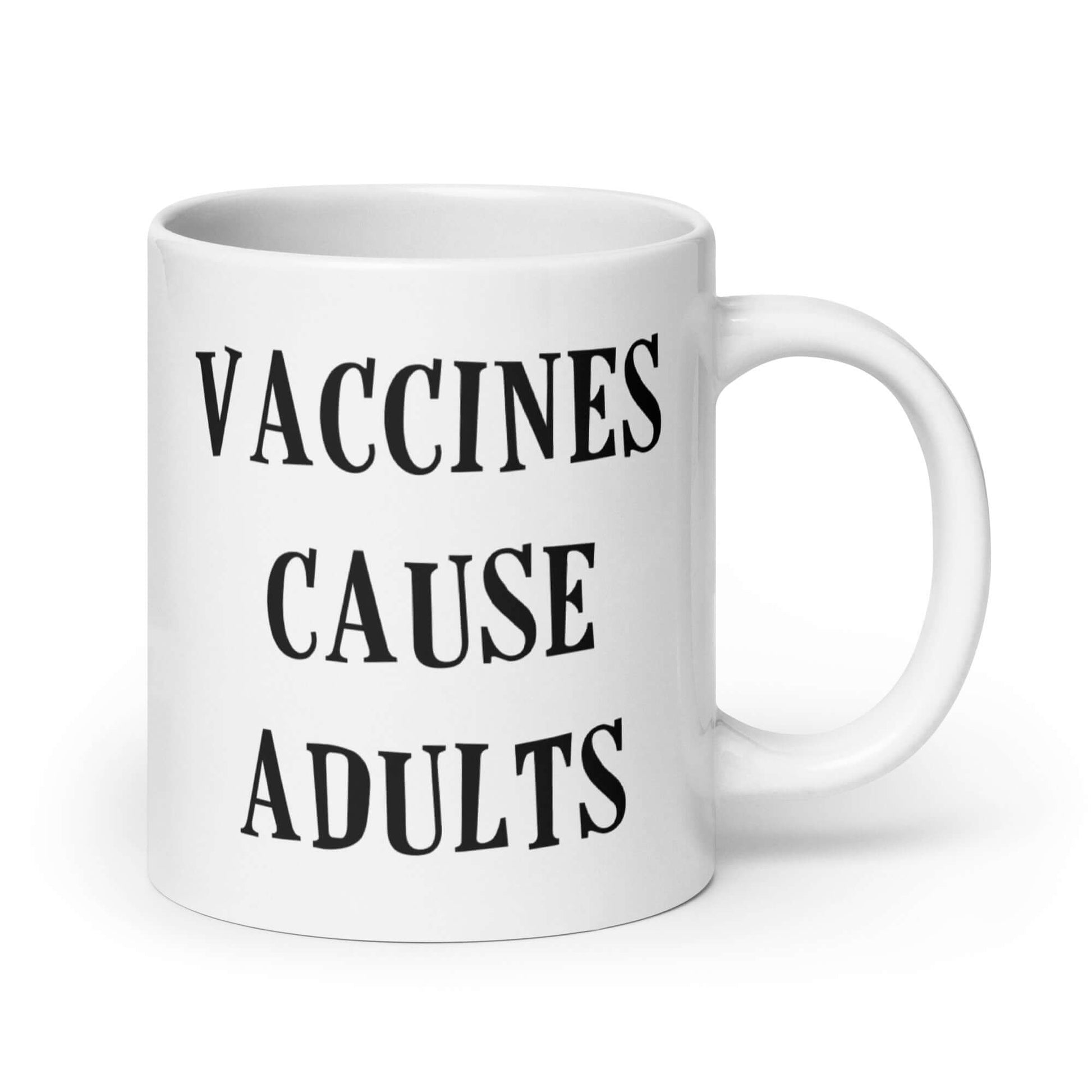 White ceramic mug with the words Vaccines cause adults printed on both sides.