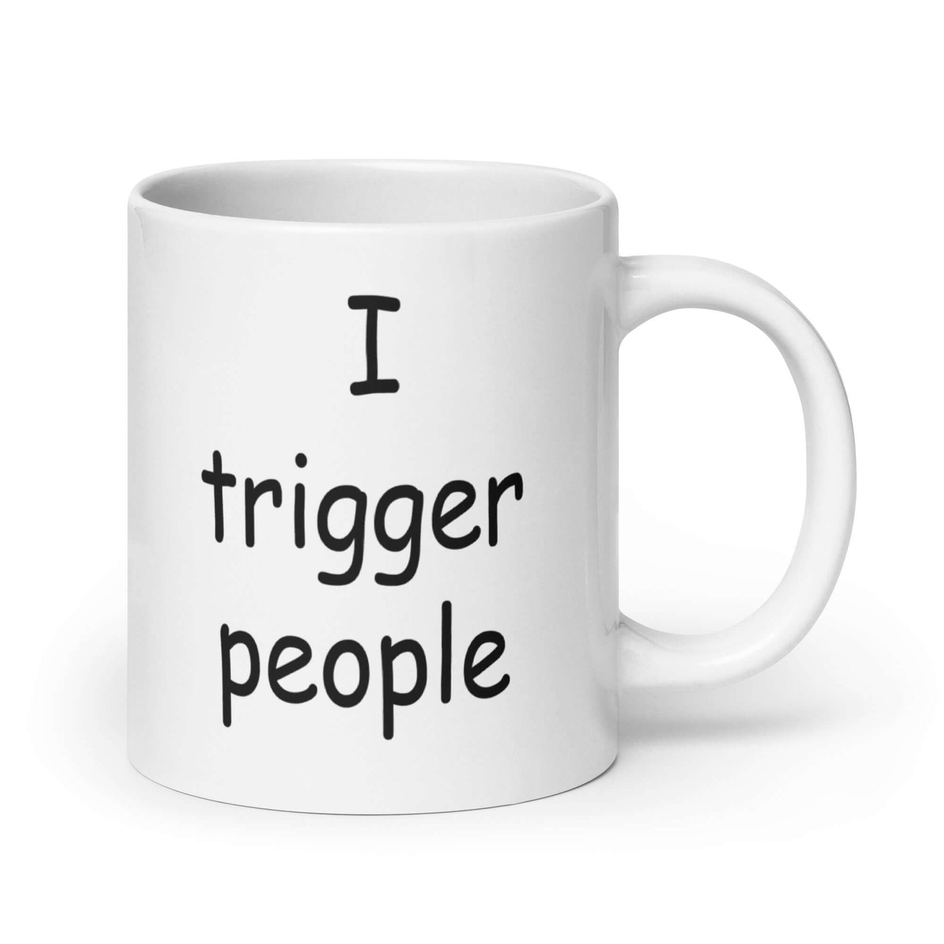 White ceramic coffee mug with the phrase I trigger people printed on both sides.