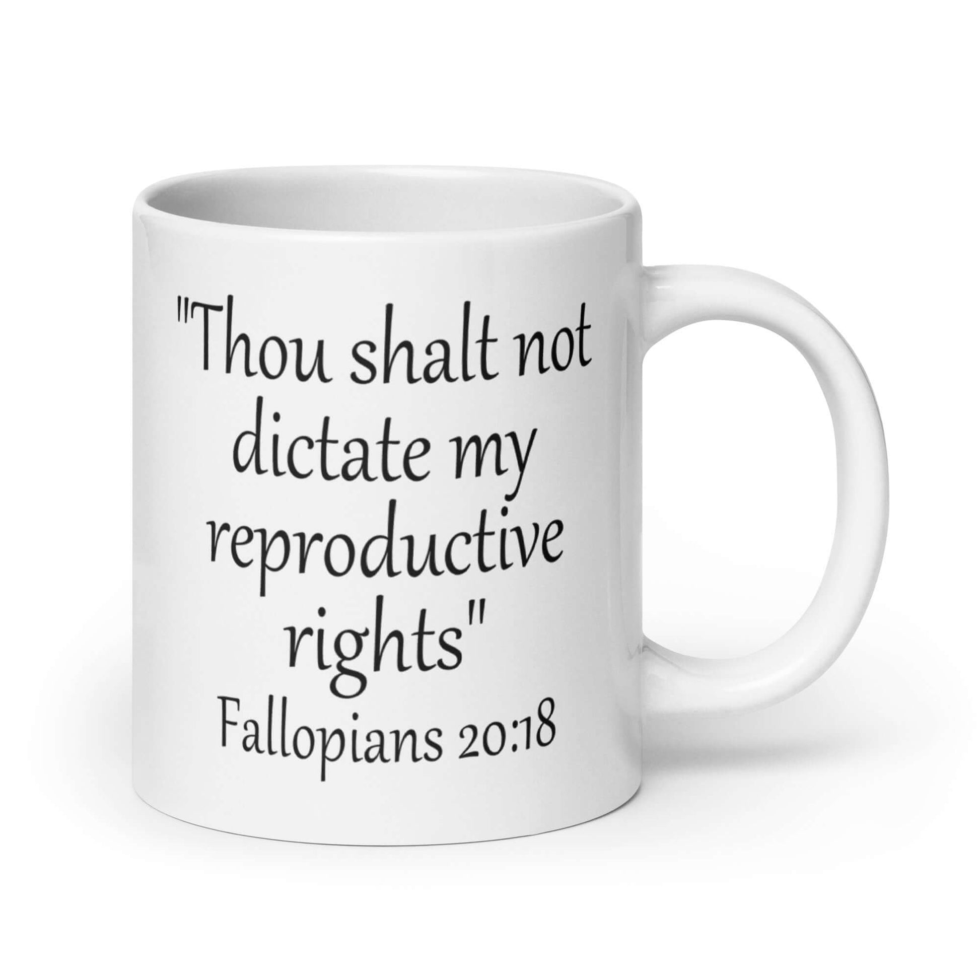 White ceramic coffee mug with the mock scripture quote Thou shalt not dictate my reproductive rights Fallopians 20:18 printed on both sides of the mug.