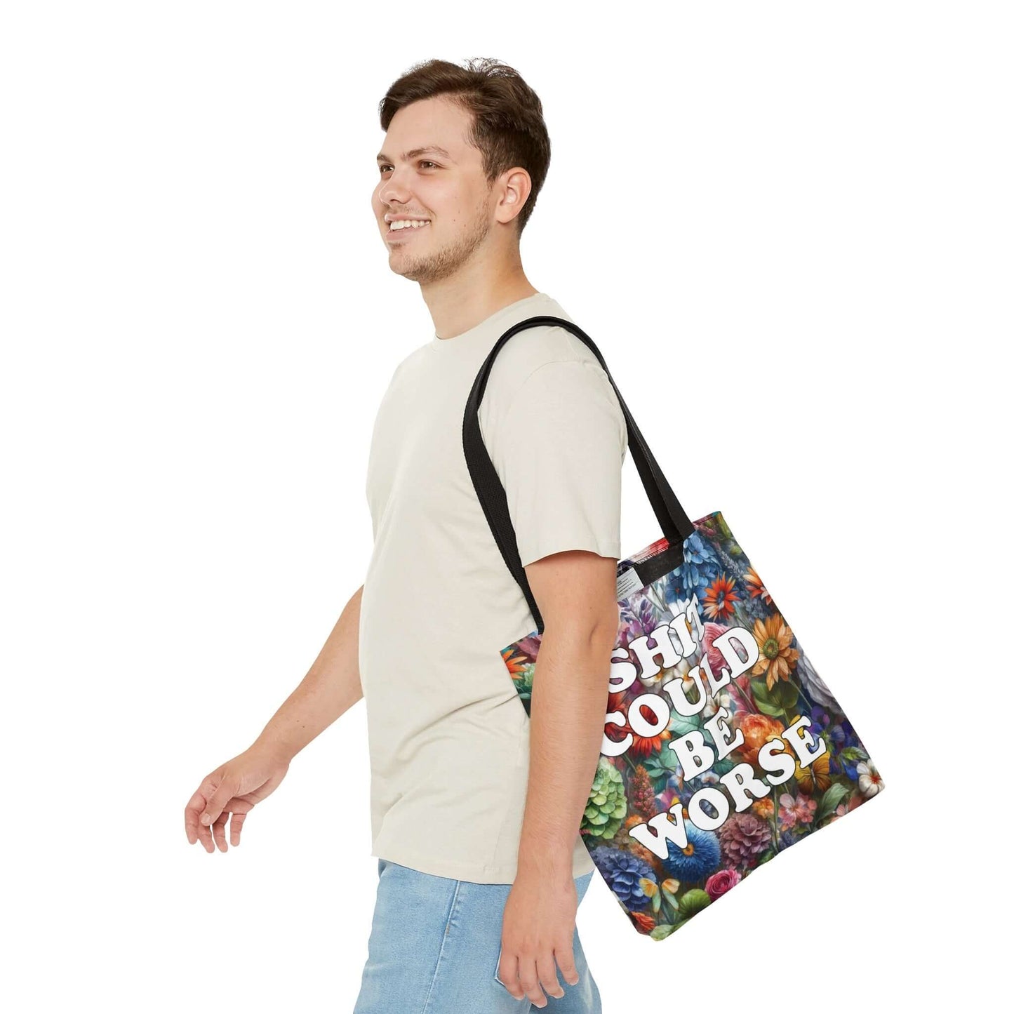 Tote bag with floral background and the words Shit could be worse printed on both sides.