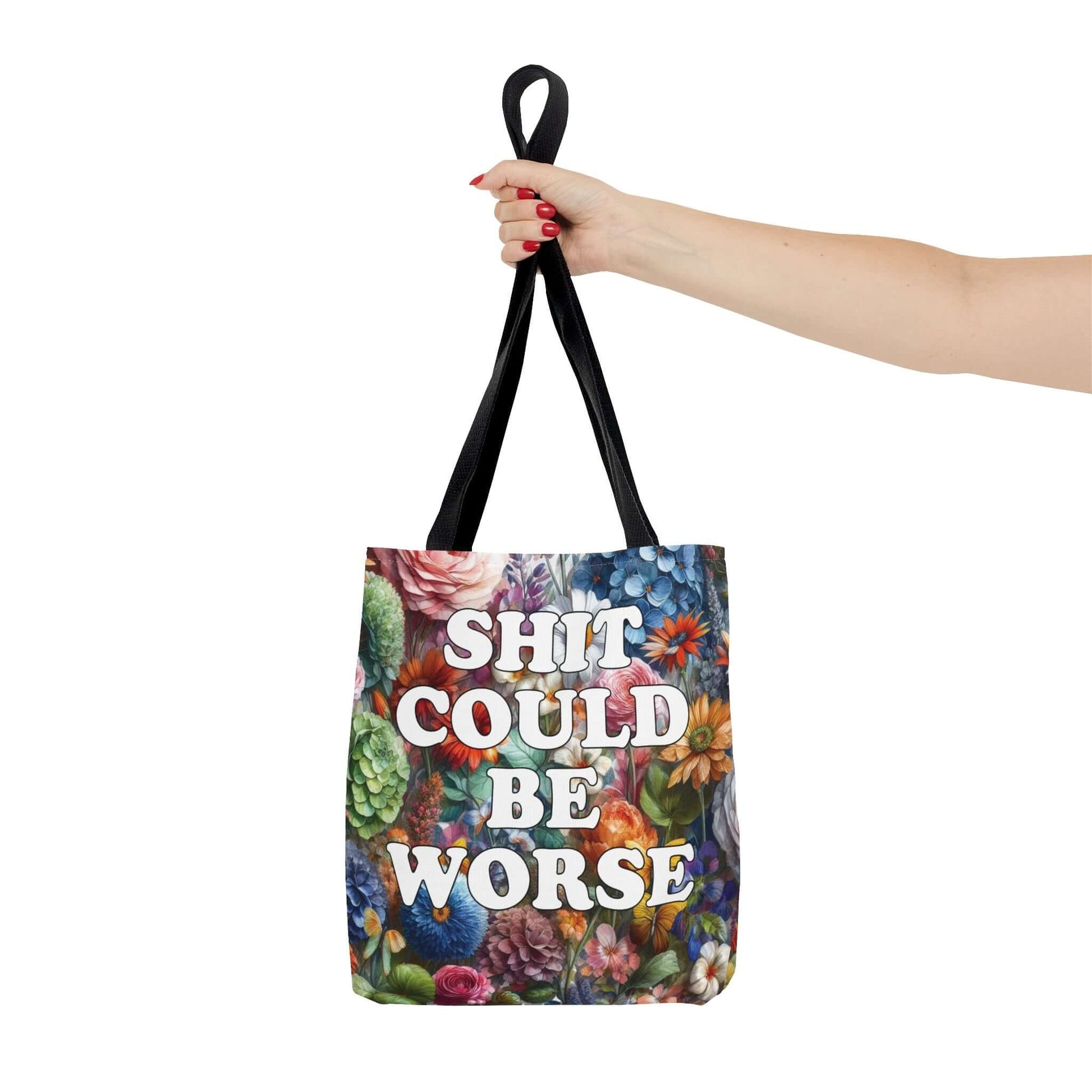 Tote bag with floral background and the words Shit could be worse printed on both sides.