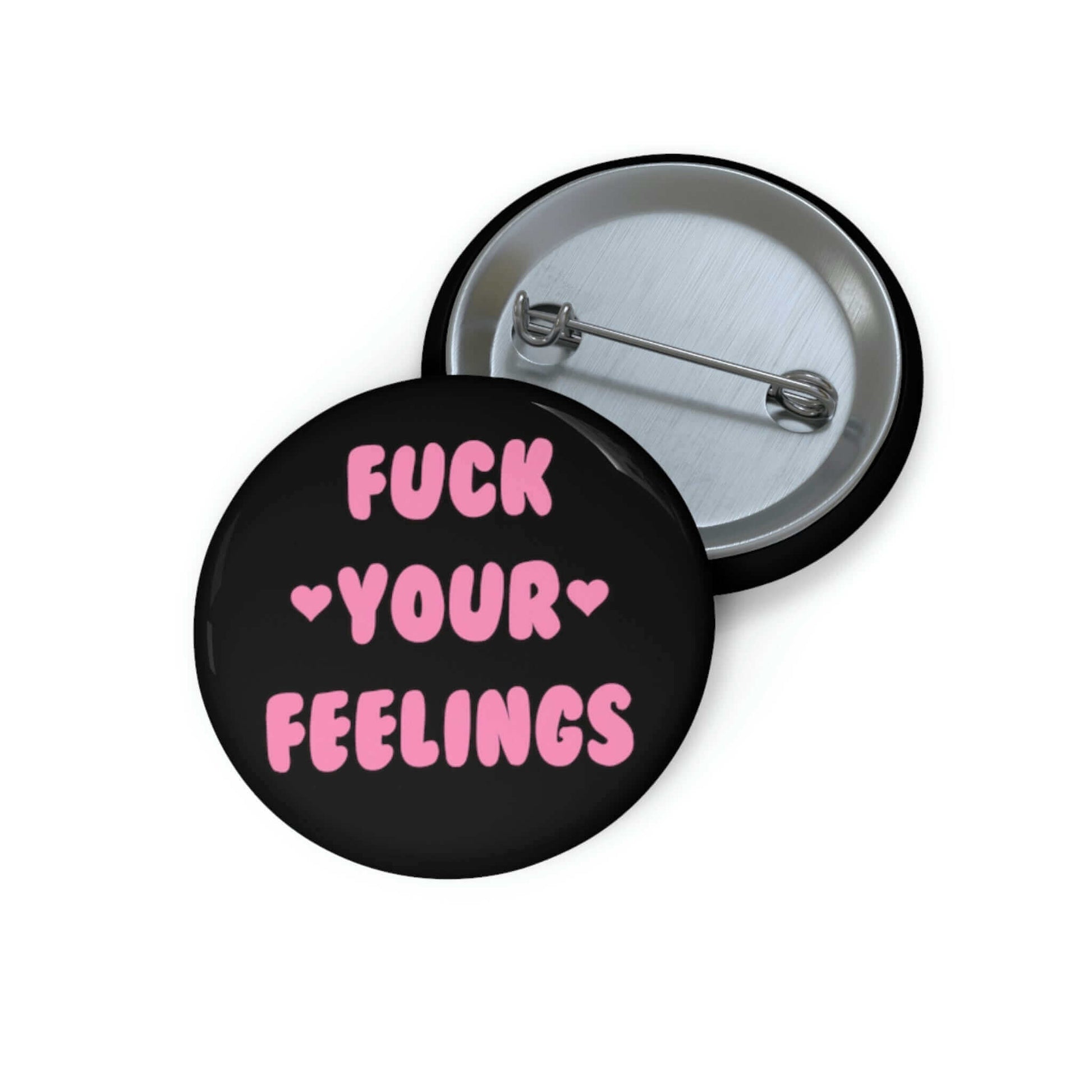 Black pinback button that says Fuck your feelings in pink. 