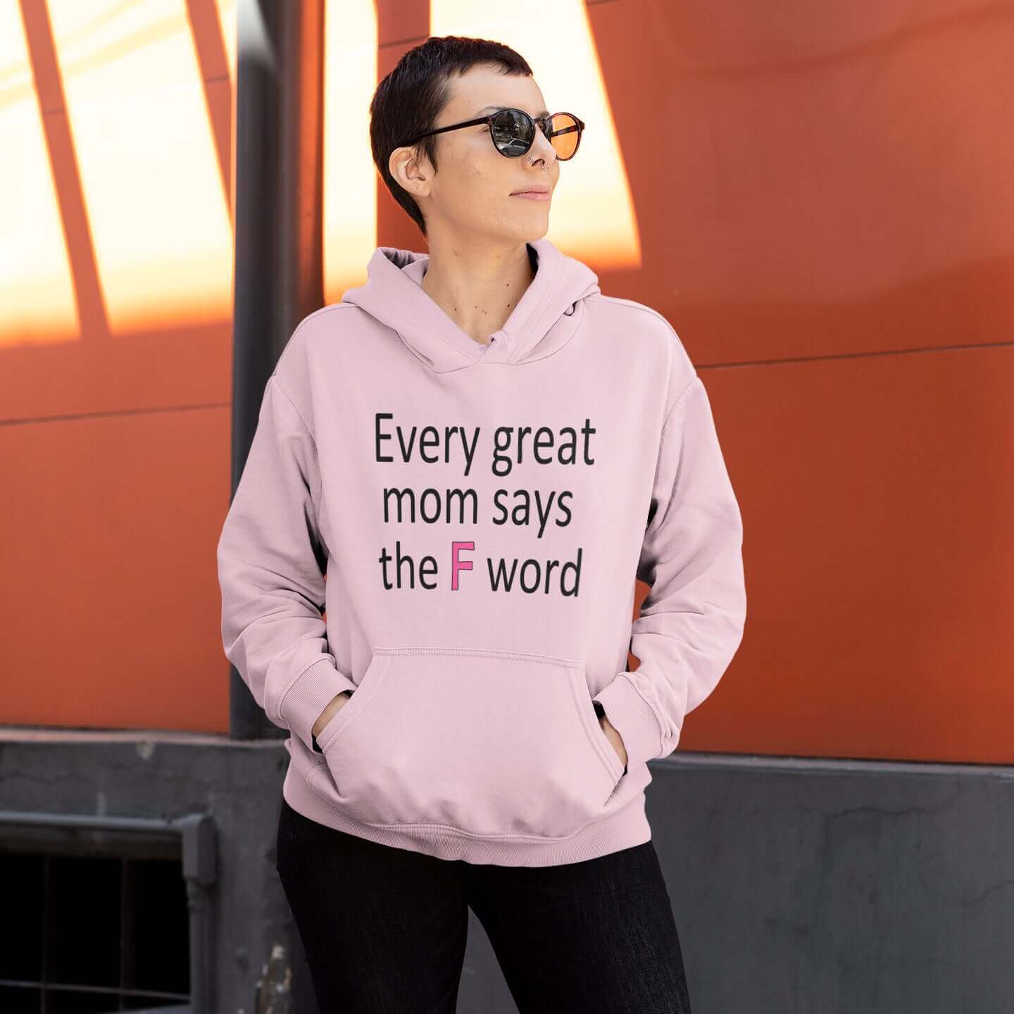woman wearing pink hooded sweatshirt every great mom says the f word hoodie witticismsrus