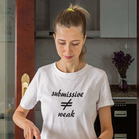 Woman wearing white t-shirt that says submissive does not equal weak.