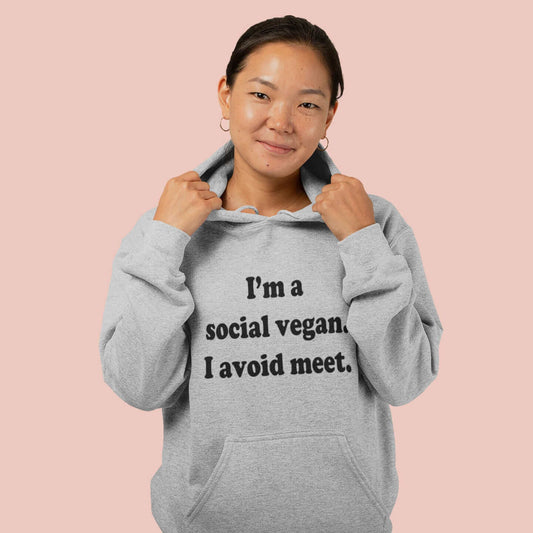 Funny meat pun hoodie. I'm a social vegan. I avoid meet hooded sweatshirt.