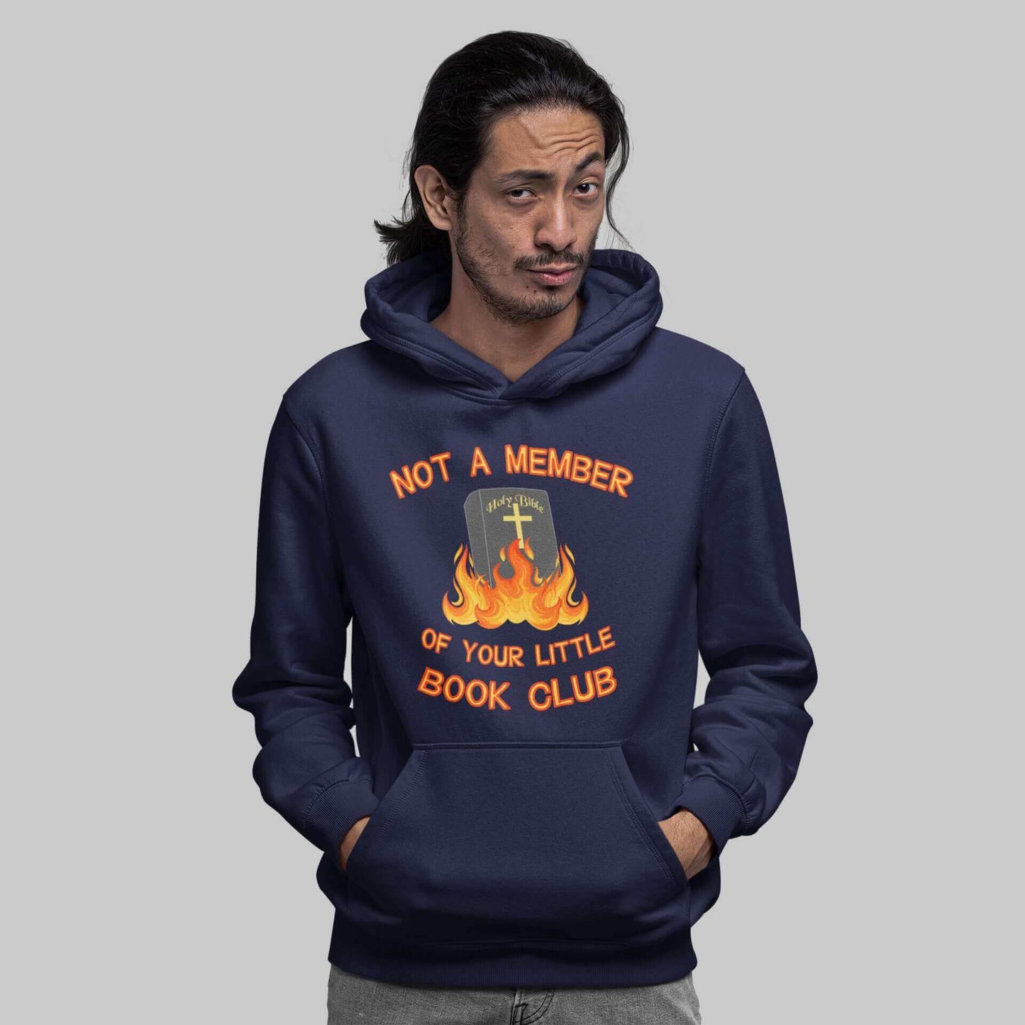 Man wearing navy blue hoodie sweatshirt with image of a burning bible and the words Not a member of your little book club printed on the front.