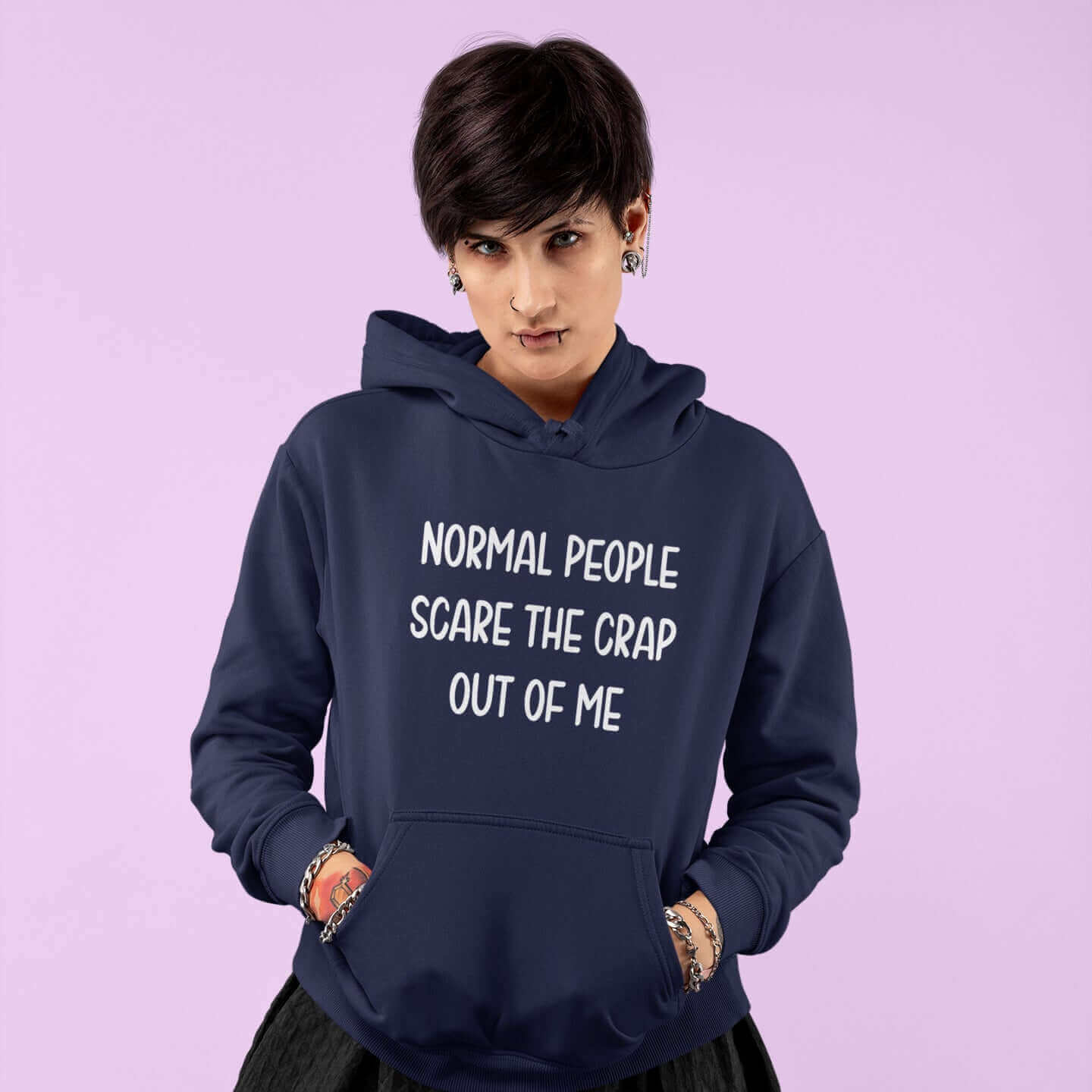 Woman wearing navy blue hoodie sweatshirt with the phrase Normal people scare the crap out of me printed on the front.