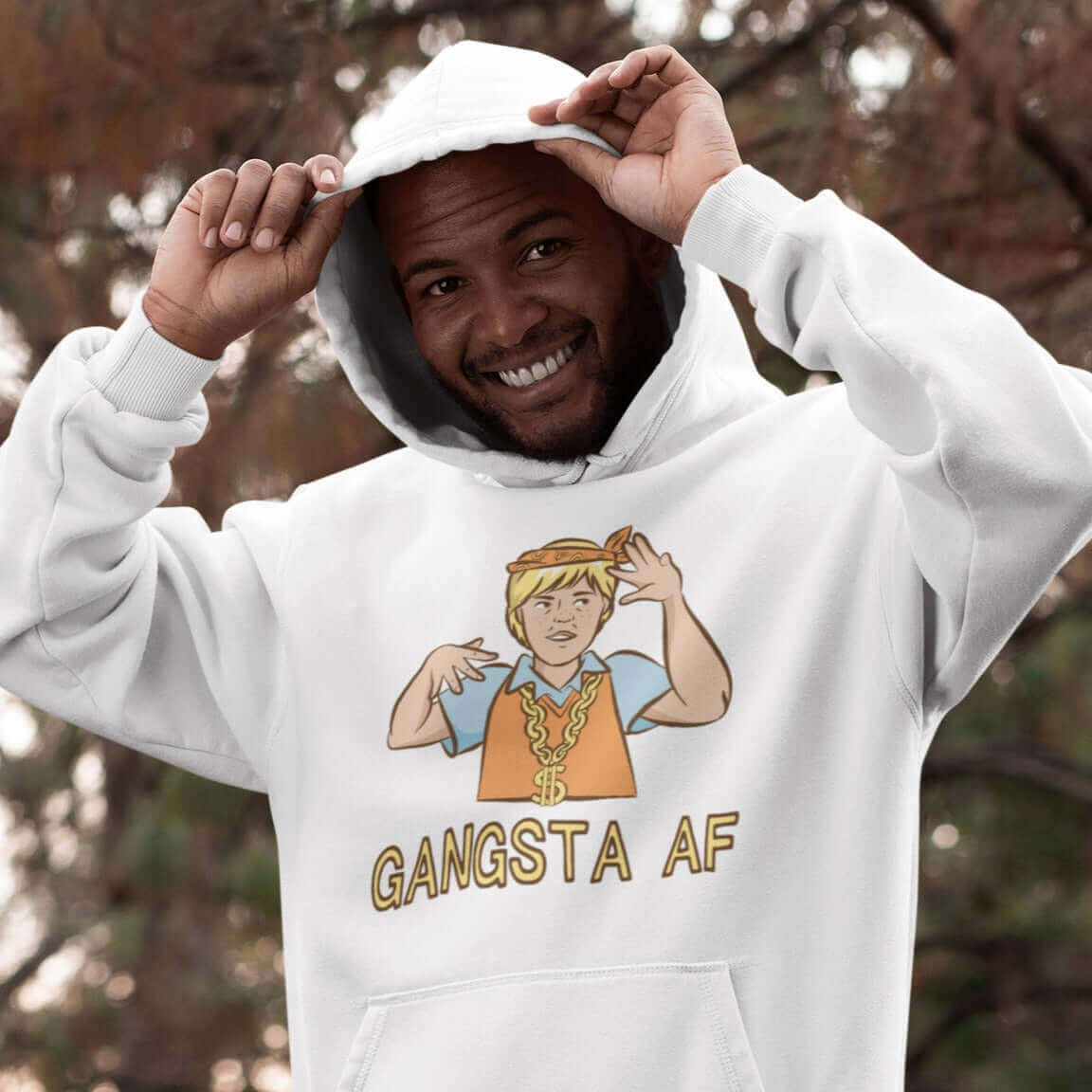 Man wearing white hoodie sweatshirt with a parody image of a blond haired child trying to be a gangster with the words Gangsta AF printed on the front.