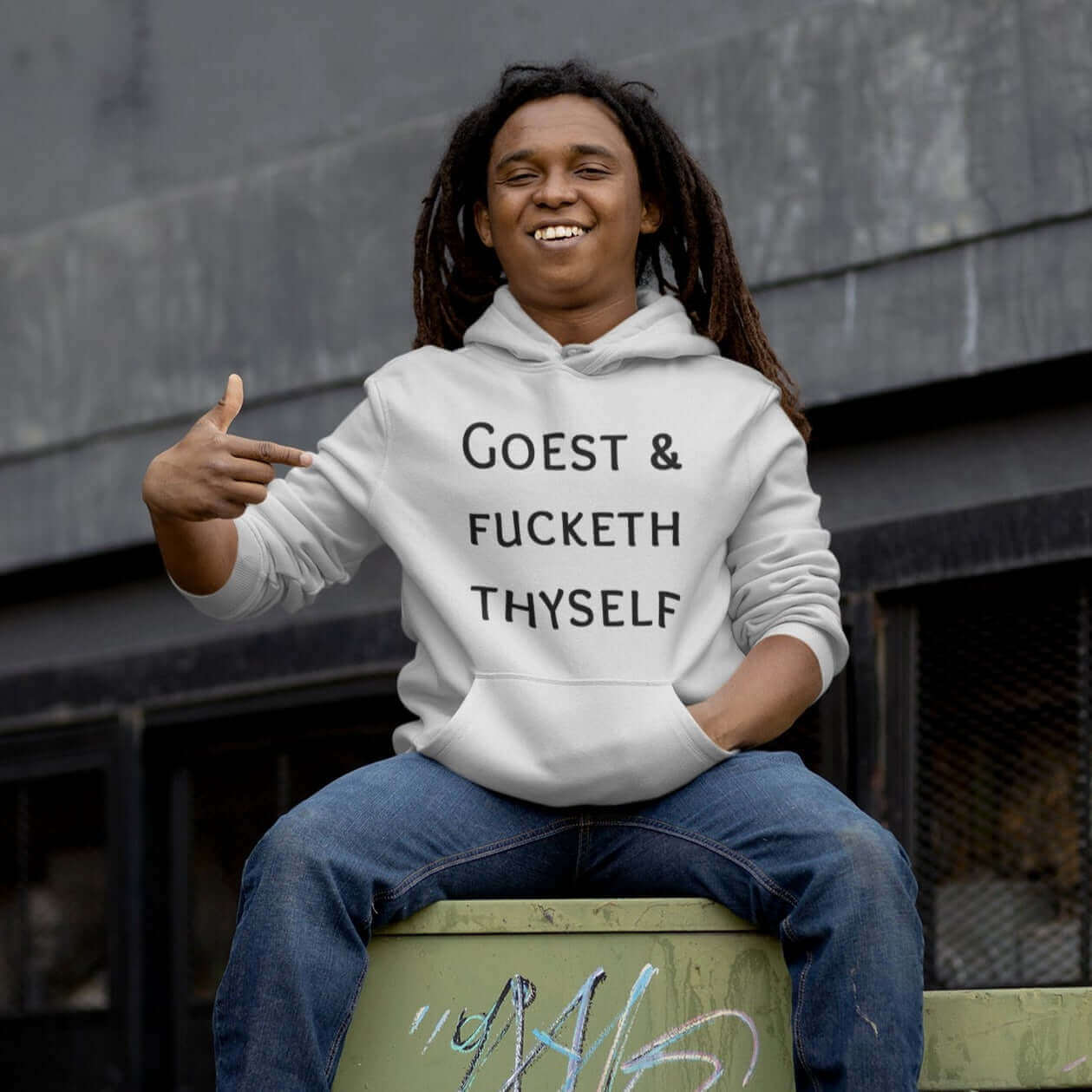 Man wearing white hooded sweatshirt with the words Goest and fucketh thyself printed on the front.