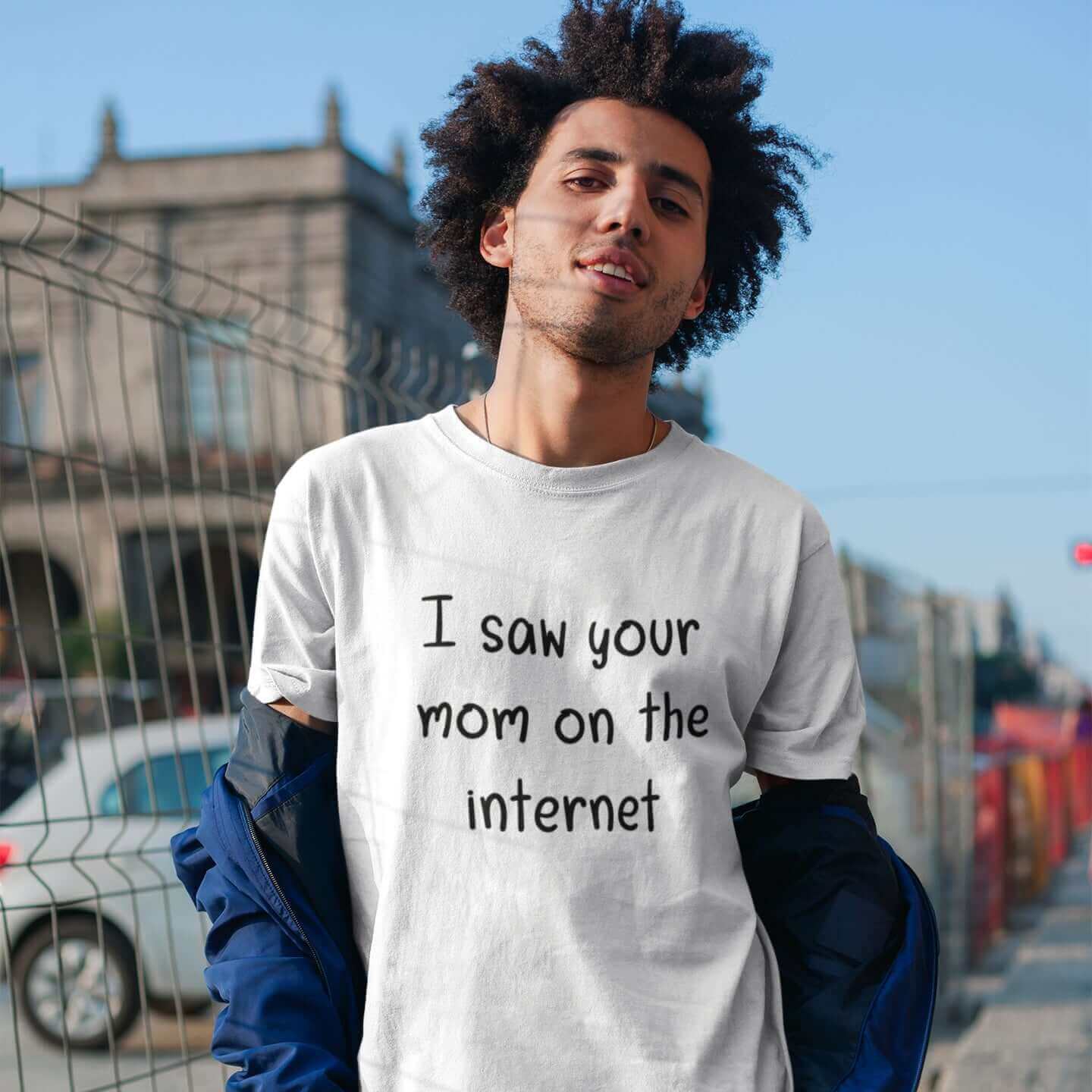 Man wearing white t-shirt with the phrase I saw your mom on the internet printed on the front.