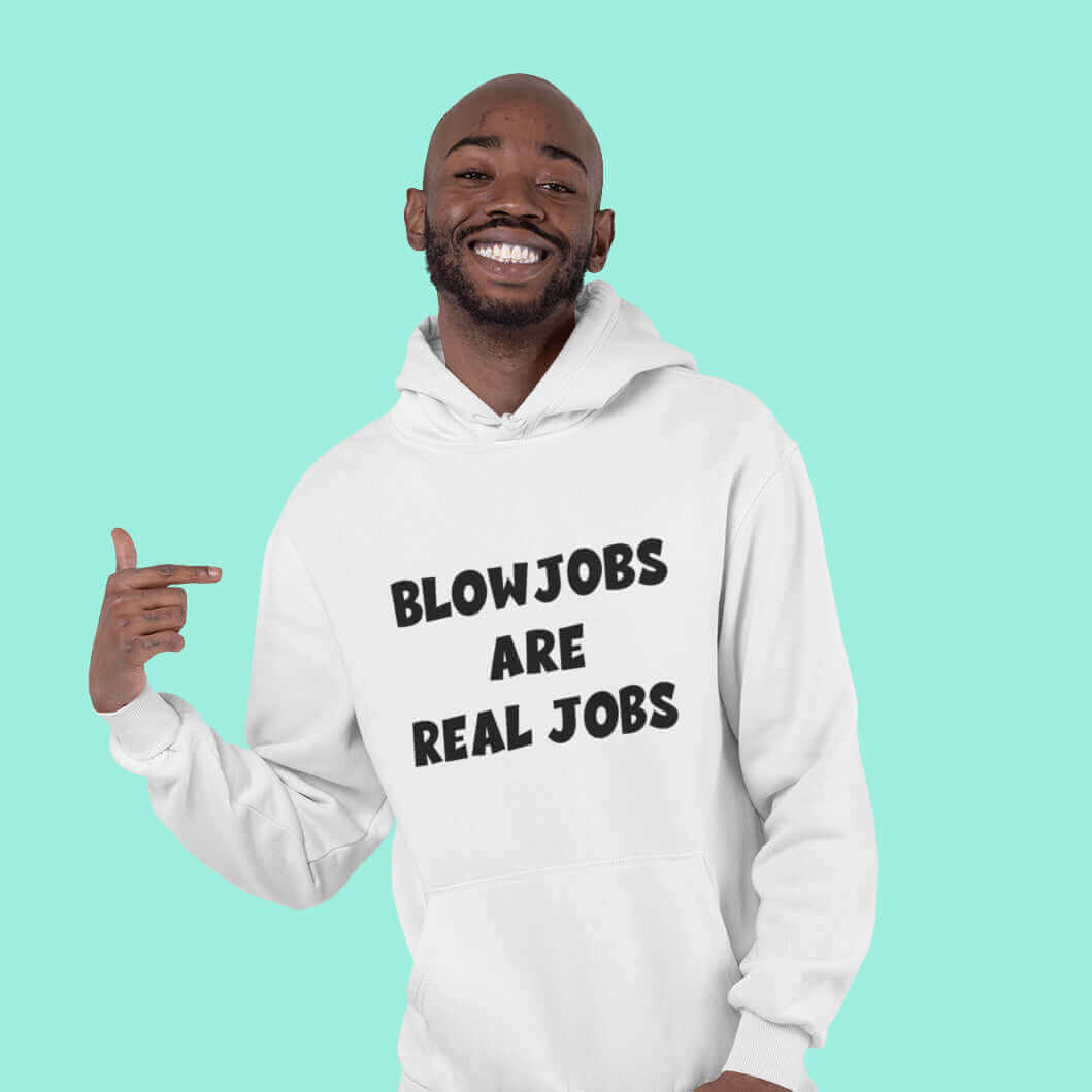 Smiling man wearing white hooded sweatshirt with the words Blowjobs are real jobs printed on the front.