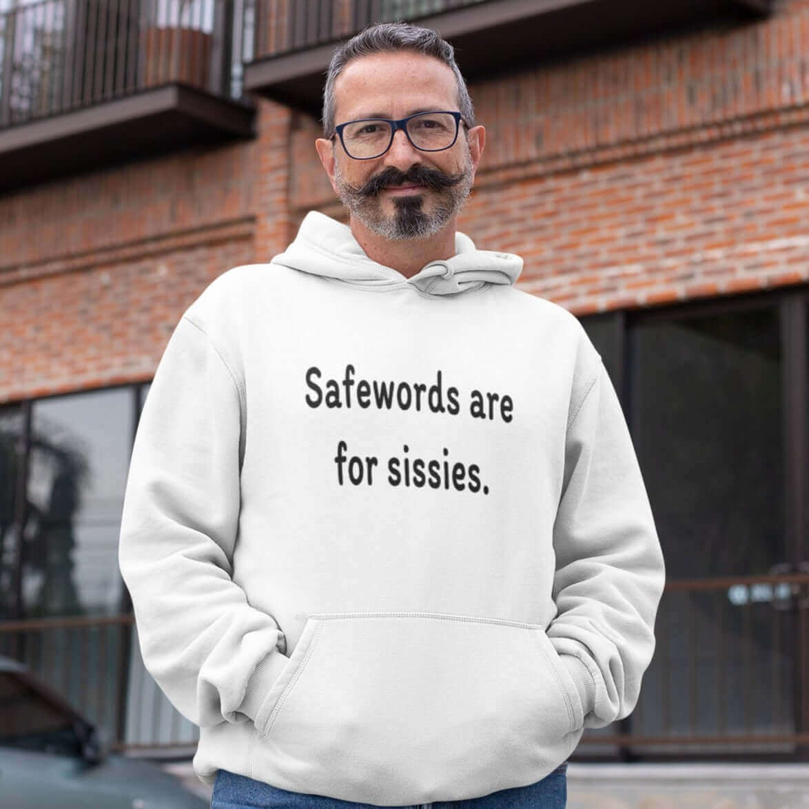 Man wearing a white hoodie sweatshirt with the phrase Safewords are for sissies printed on the front.