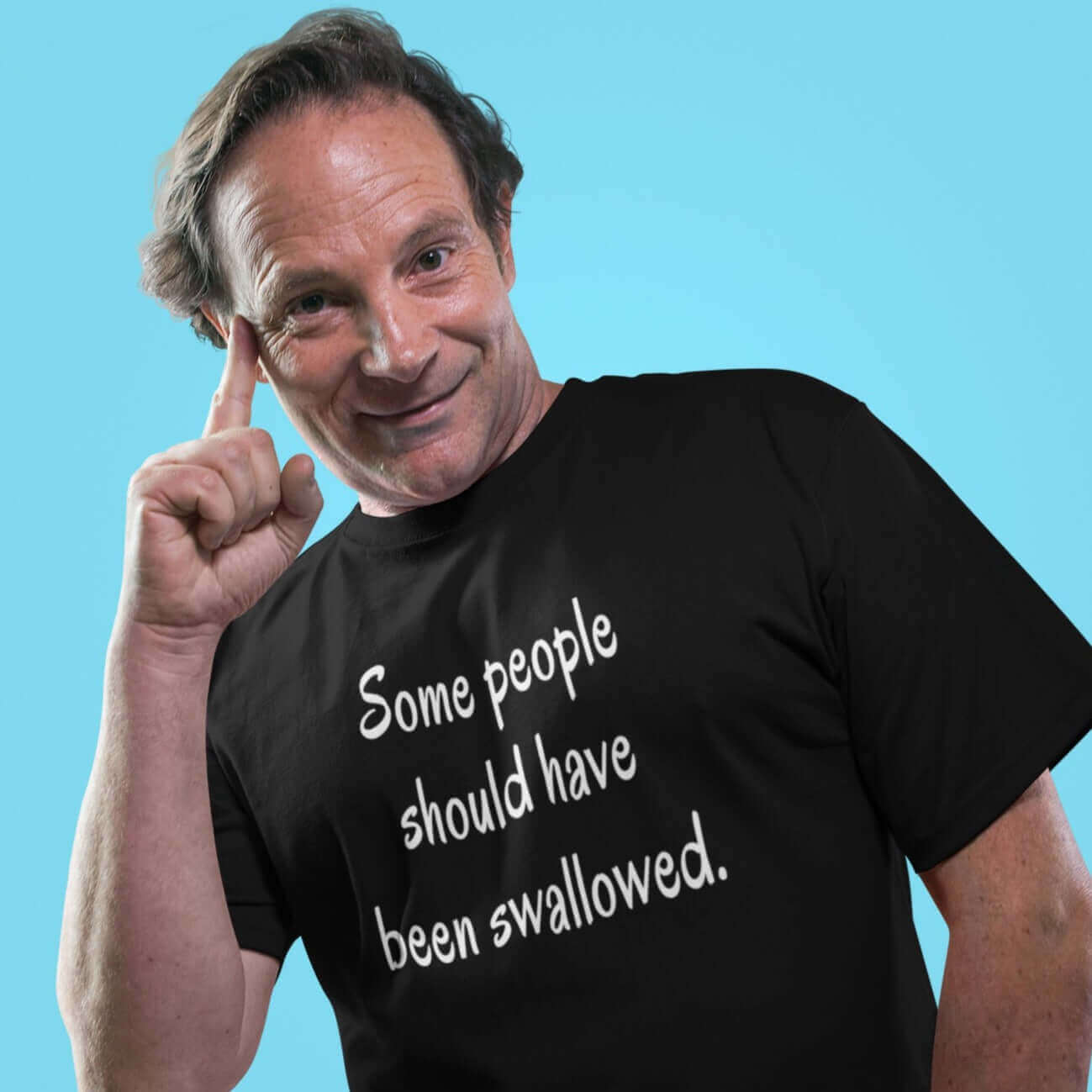 Man wearing black t-shirt with the phrase Some people should have been swallowed printed on the front.
