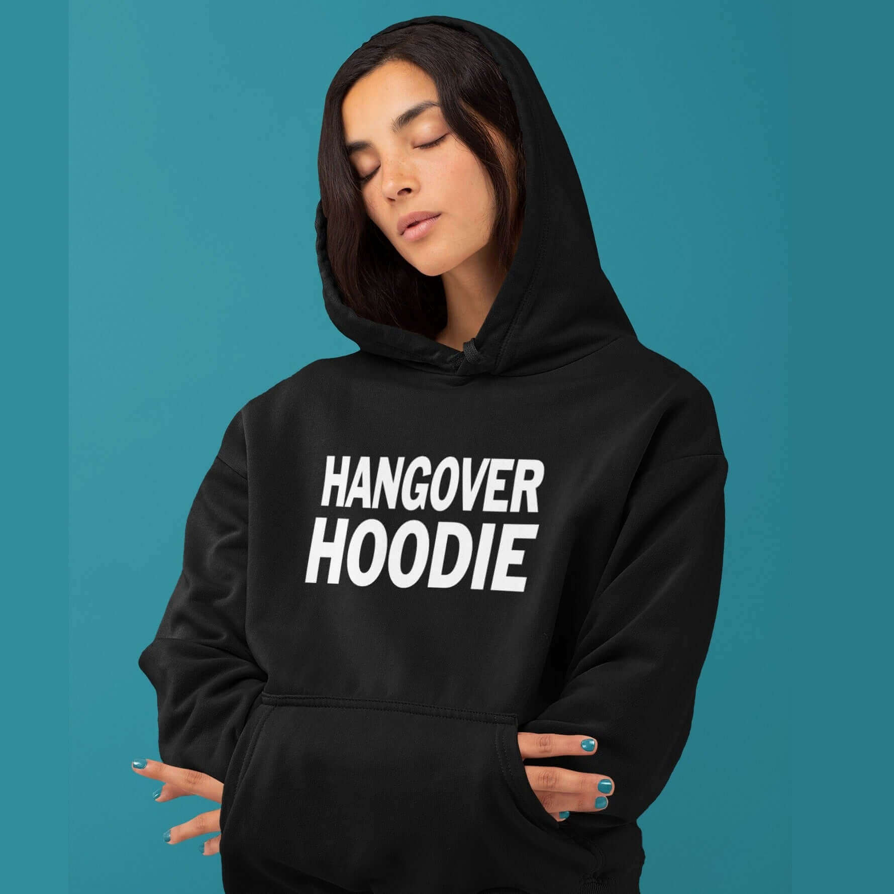 Woman wearing a black hoodie sweatshirt with the words Hangover hoodie printed on the front.