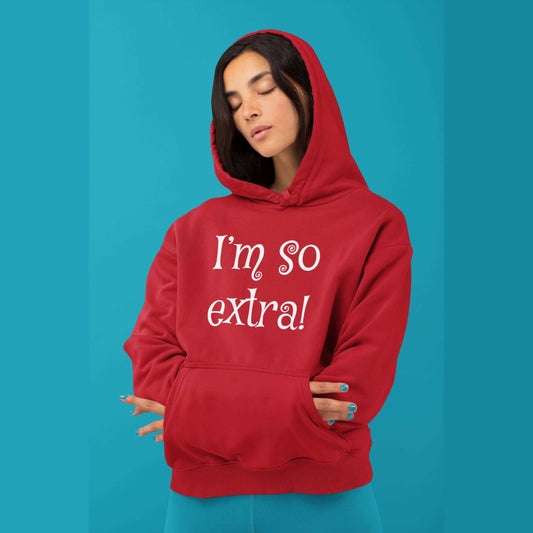 Woman wearing a red hoodie sweatshirt with the words I'm so extra printed on the front.