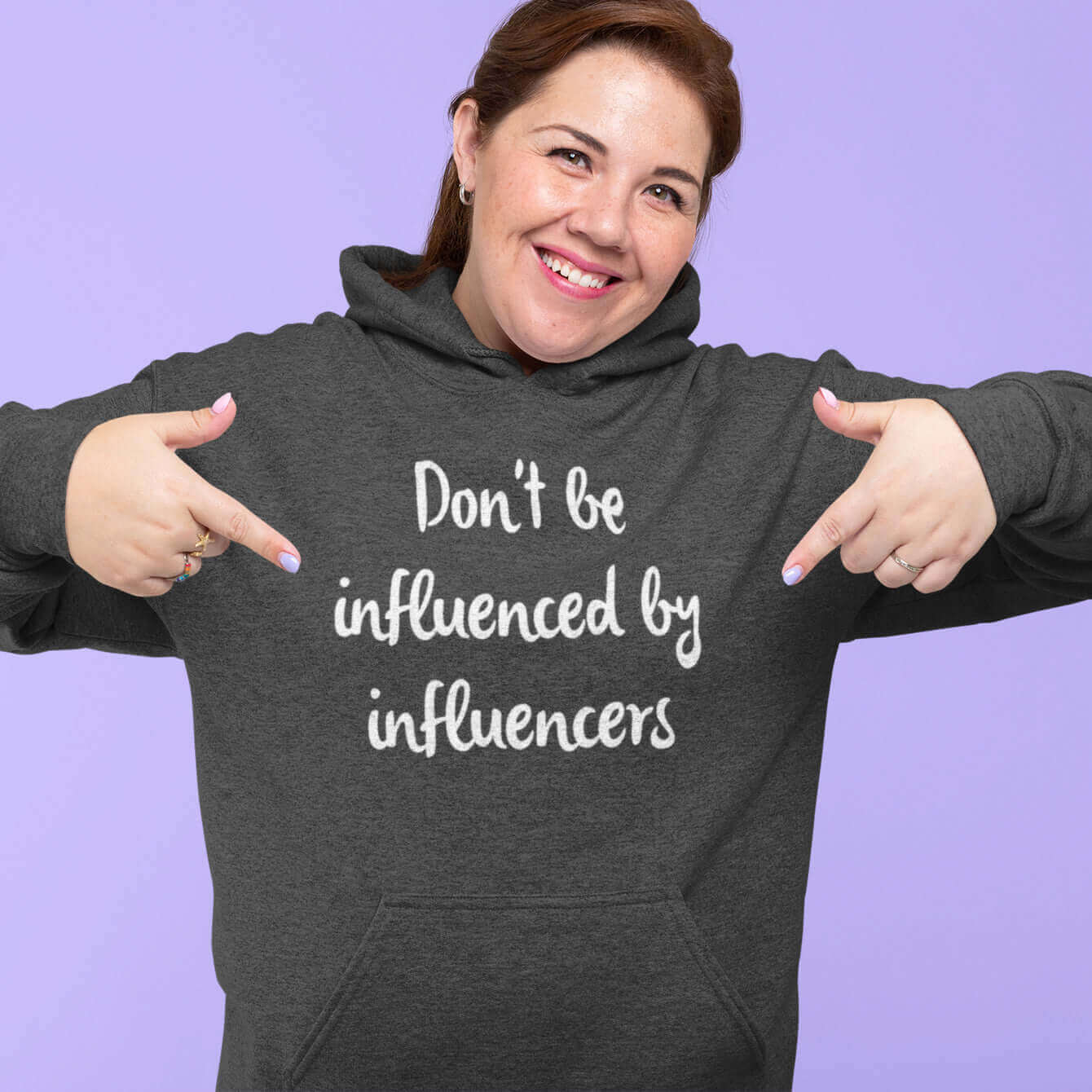 woman wearing dark gray hoodie that says don't be influenced by influencers social media influencer witticismsrus