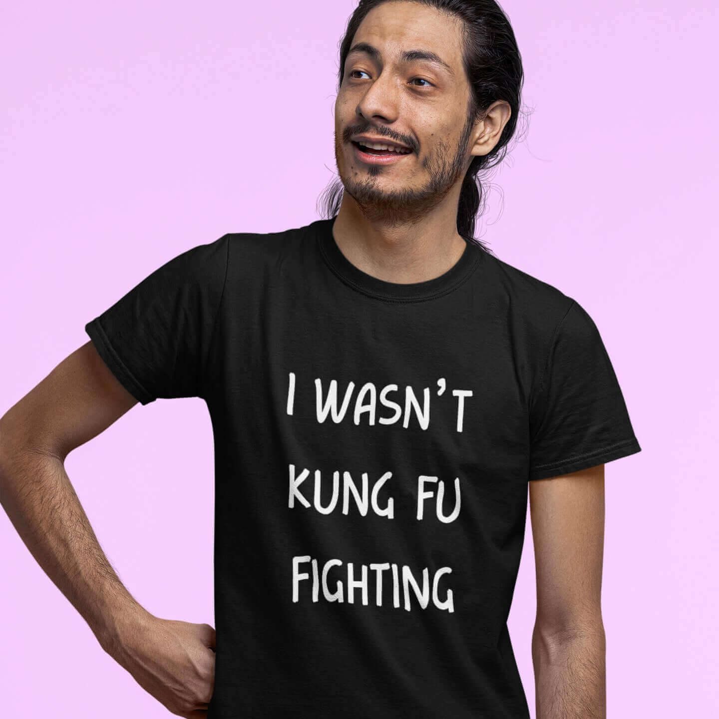 Man wearing black t-shirt with the funny phrase I wasn't kung fu fighting printed on the front.