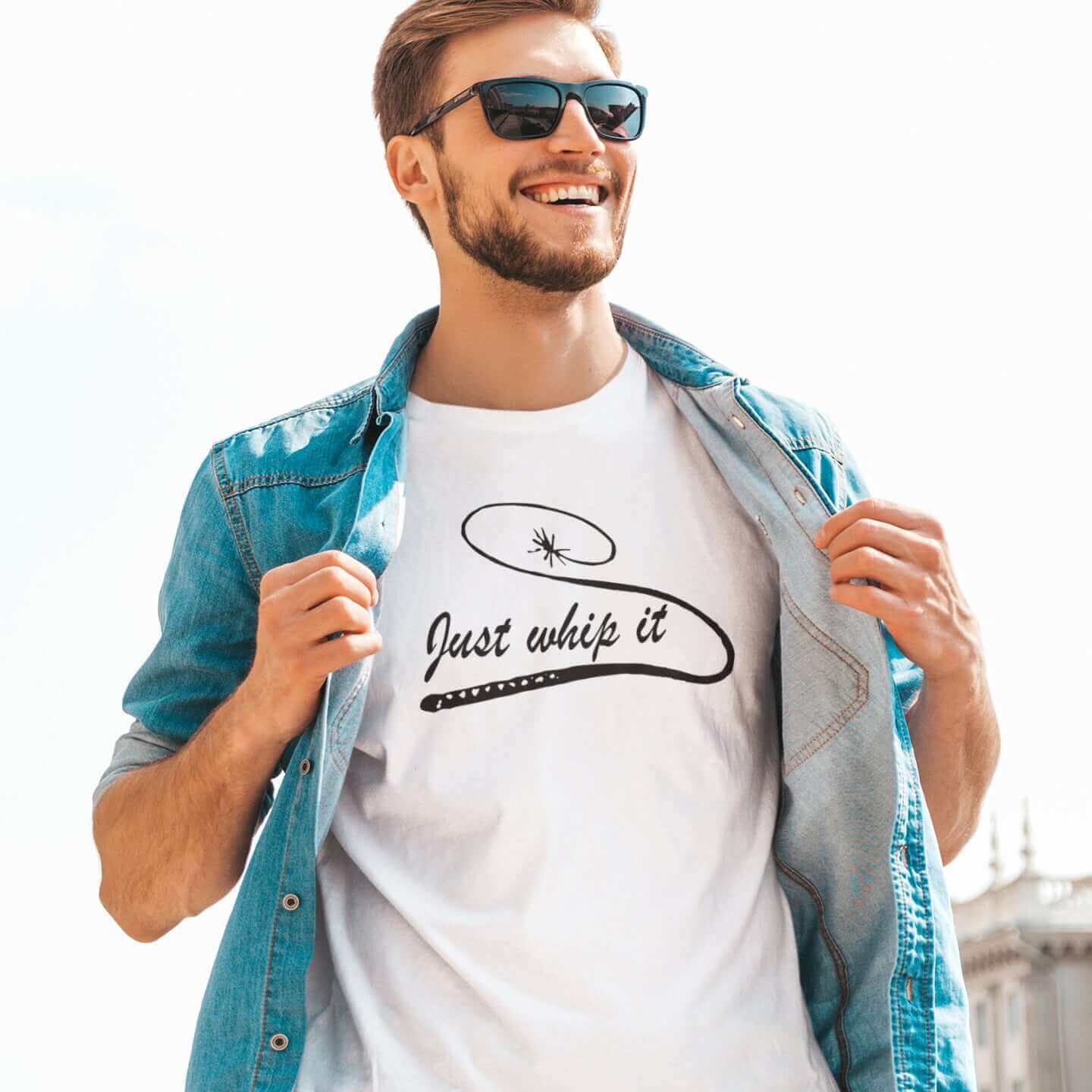 Man wearing a white t-shirt with line drawing image of a leather bullwhip and the words Just whip it printed on the front.