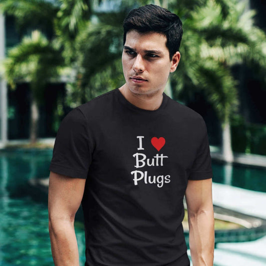 Handsome man wearing t-shirt with I heart butt plugs printed on the front.