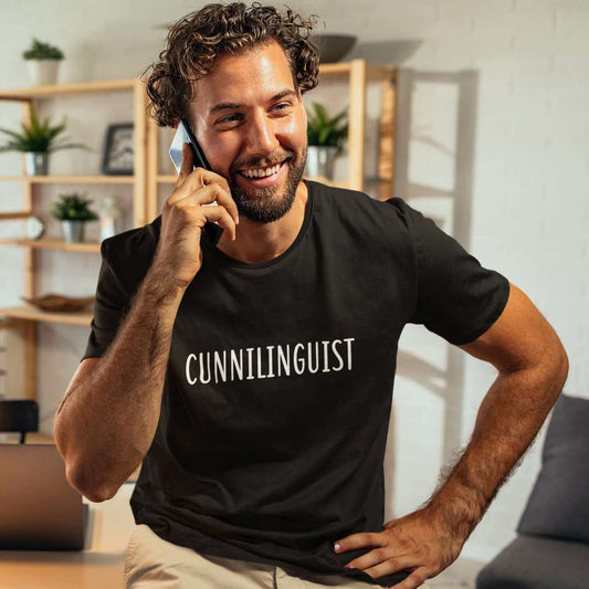 Man wearing black t-shirt with the word Cunnilinguist printed on the front.