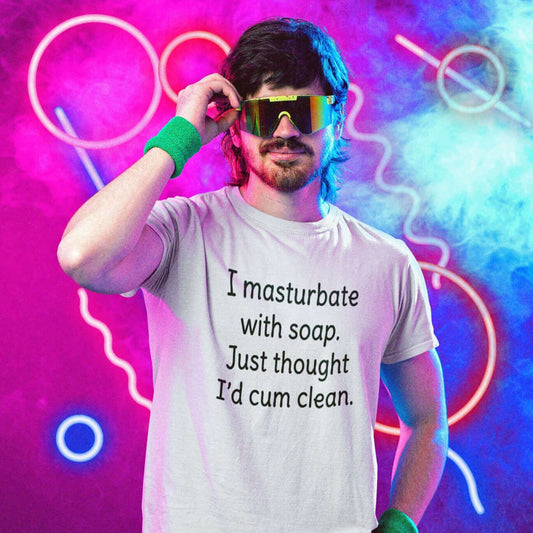 Man in a fun retro 80's setting wearing a white t-shirt with the funny phrase I masturbate with soap, just thought I'd cum clean printed on the front.