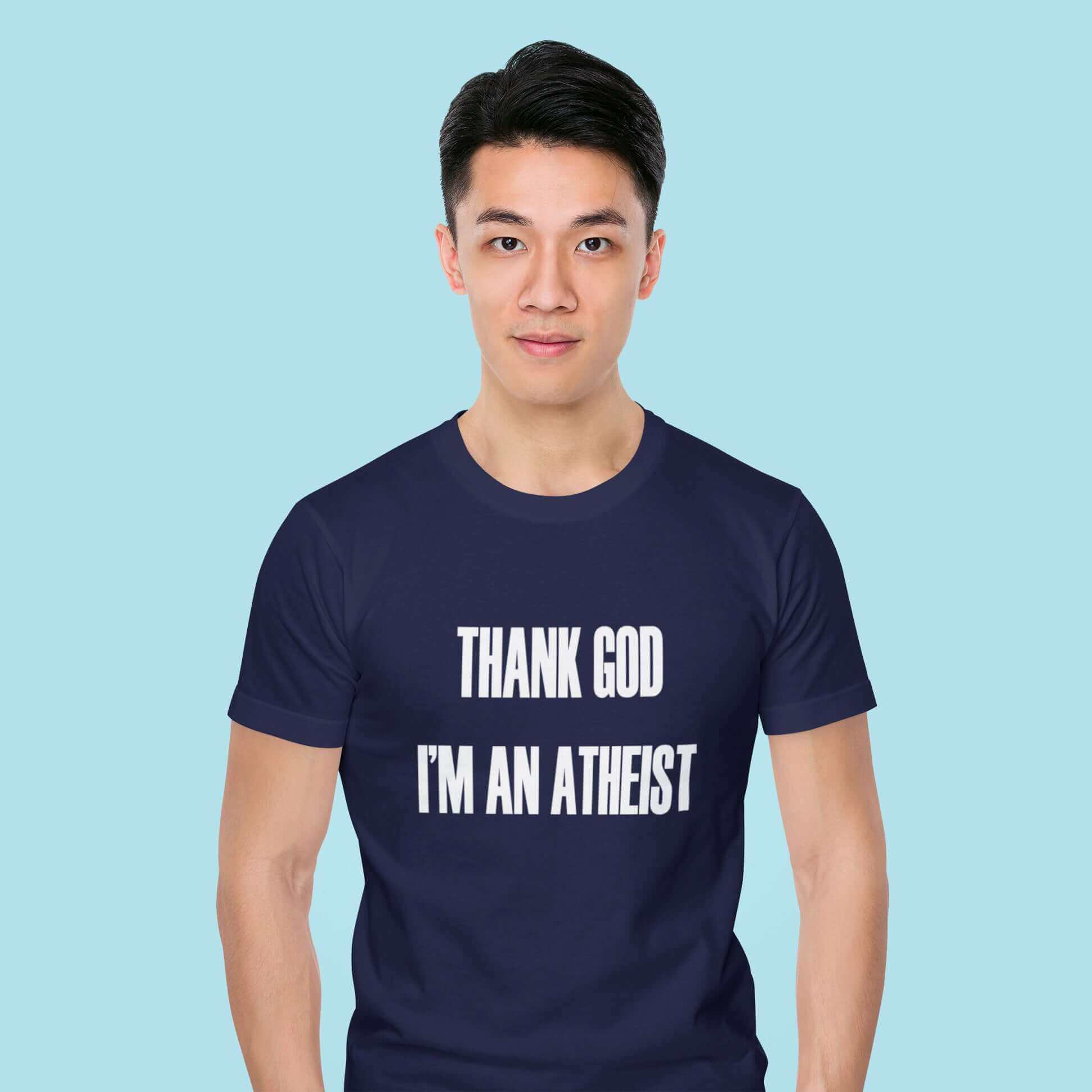 Man wearing navy blue t-shirt with Thank God I'm an atheist printed on the front.