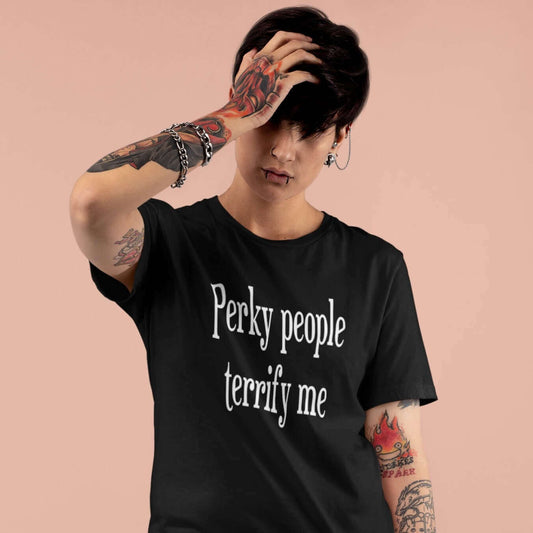 Woman wearing black t-shirt with the phrase Perky people terrify me printed on the front.