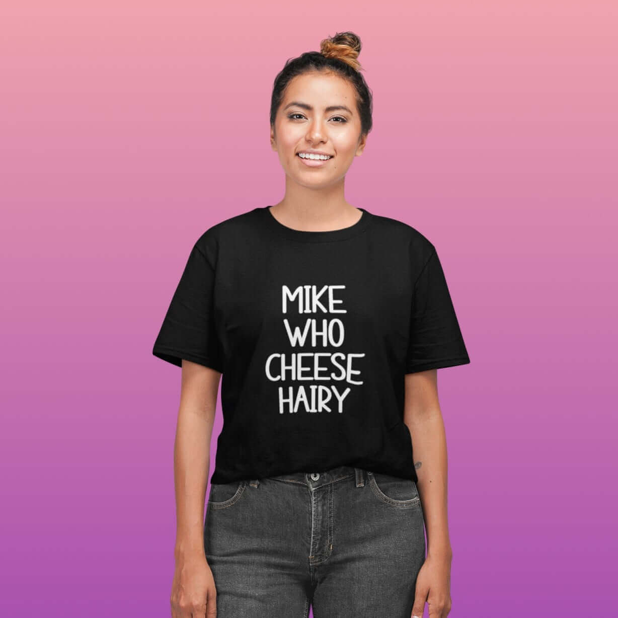 Smiling woman wearing black pun t-shirt with the words Mike who cheese hairy printed on the front.